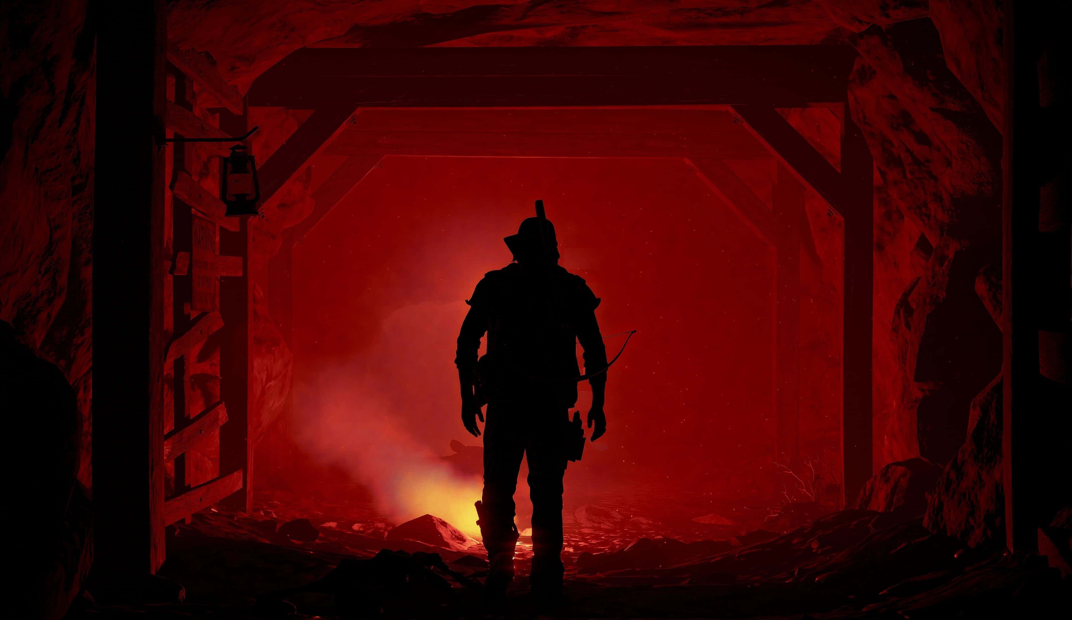 Survival Games 桌布 壁紙 — 一個孤獨礦工的剪影站在黑暗隧道口，面向下方發光的紅色熔岩流。