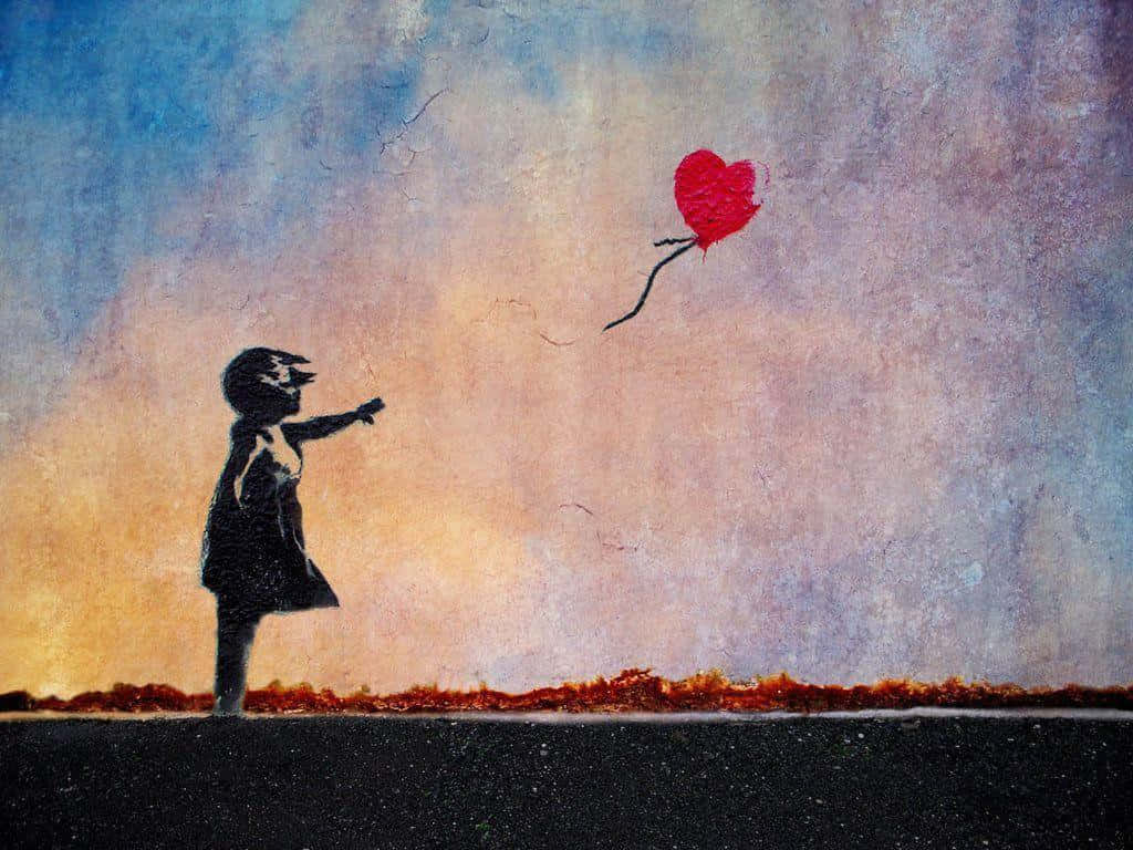 Banksy 桌布 壁紙 — 一個孩子的剪影在紋理豐富的暮色天空中伸手觸摸漂浮的紅色心形氣球。