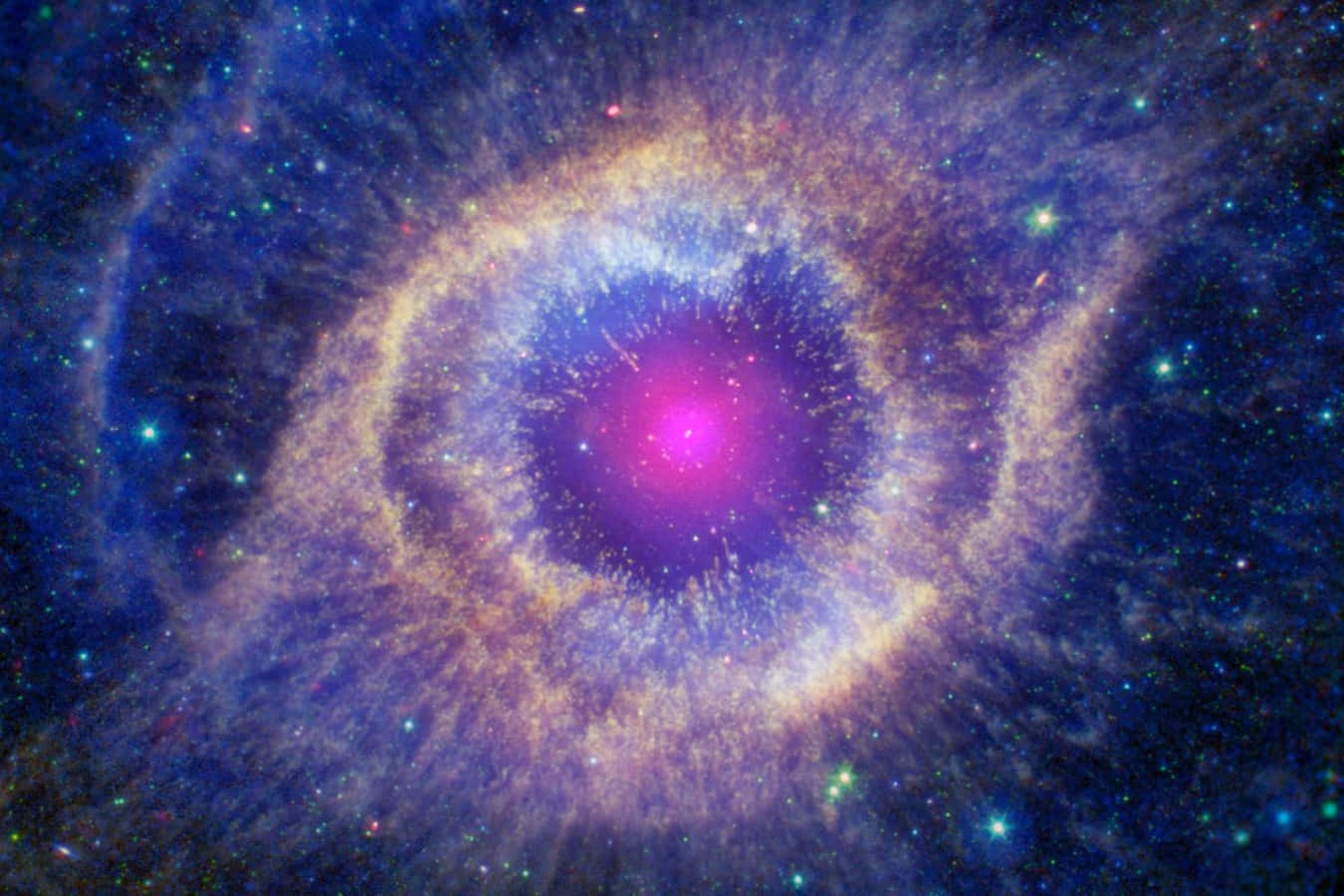 Nasa Galaxy 桌布 壁紙 — 一個宇宙星雲，中心發出粉紅色光芒，周圍環繞著旋轉的藍色和金色氣體雲，點綴著遙遠的星星。