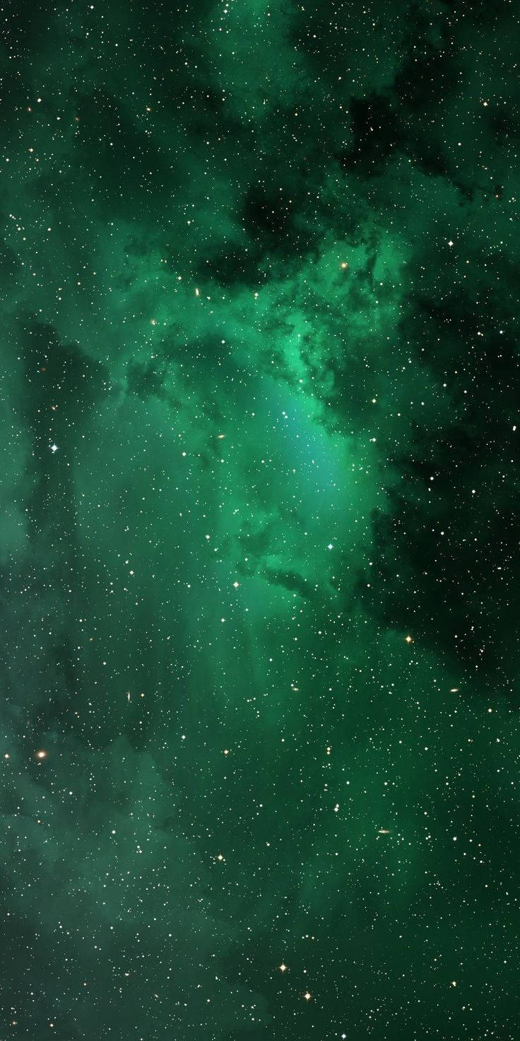 Stars 桌布 壁紙 — 一個宇宙星雲，在黑暗虛空中閃耀著翠綠色氣體和散落的星星。