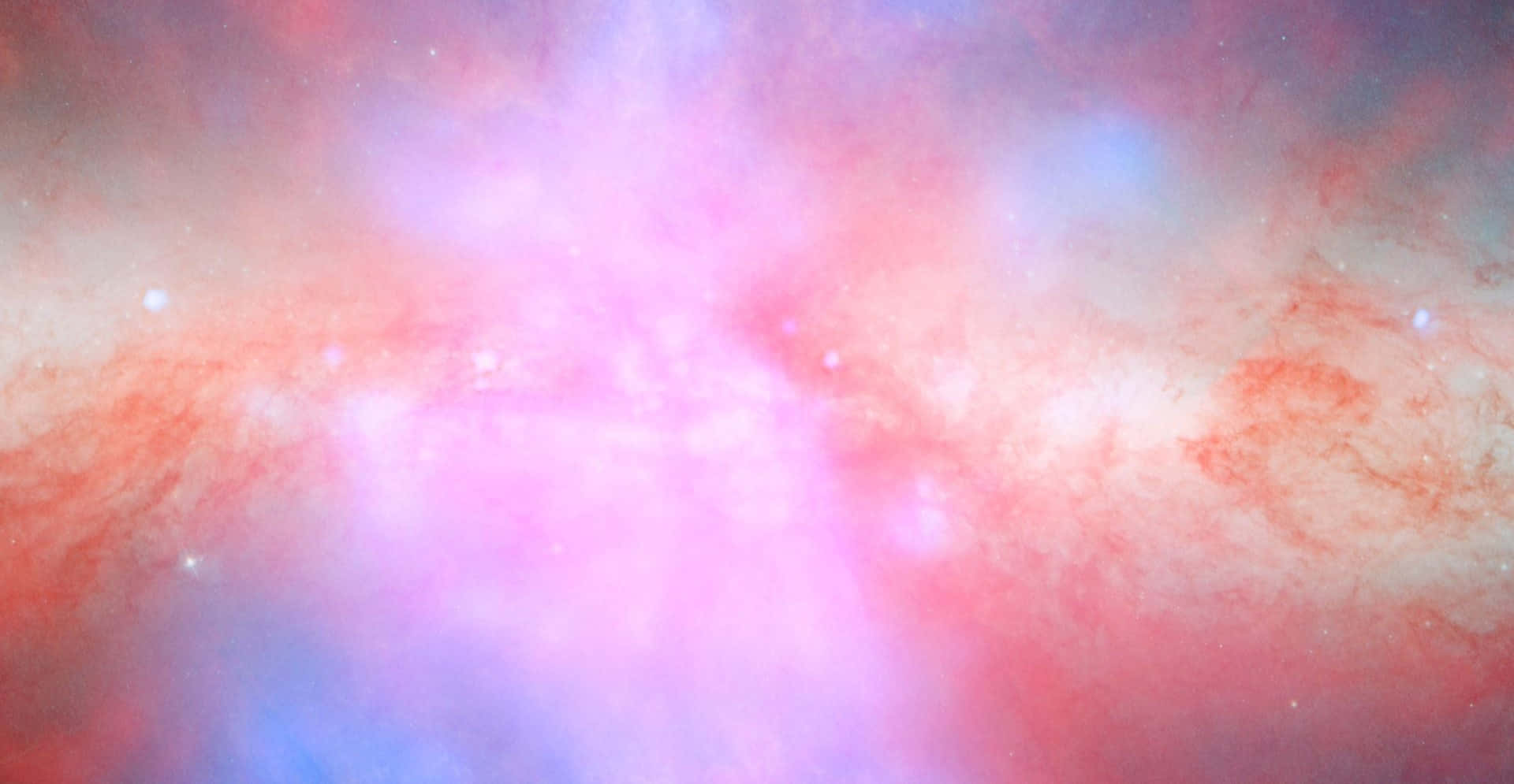 粉紅銀河 桌布 壁紙 — 一個宇宙星雲以充滿活力的粉紅色和藍色旋轉，散落的星星在宇宙背景下柔和地發光。