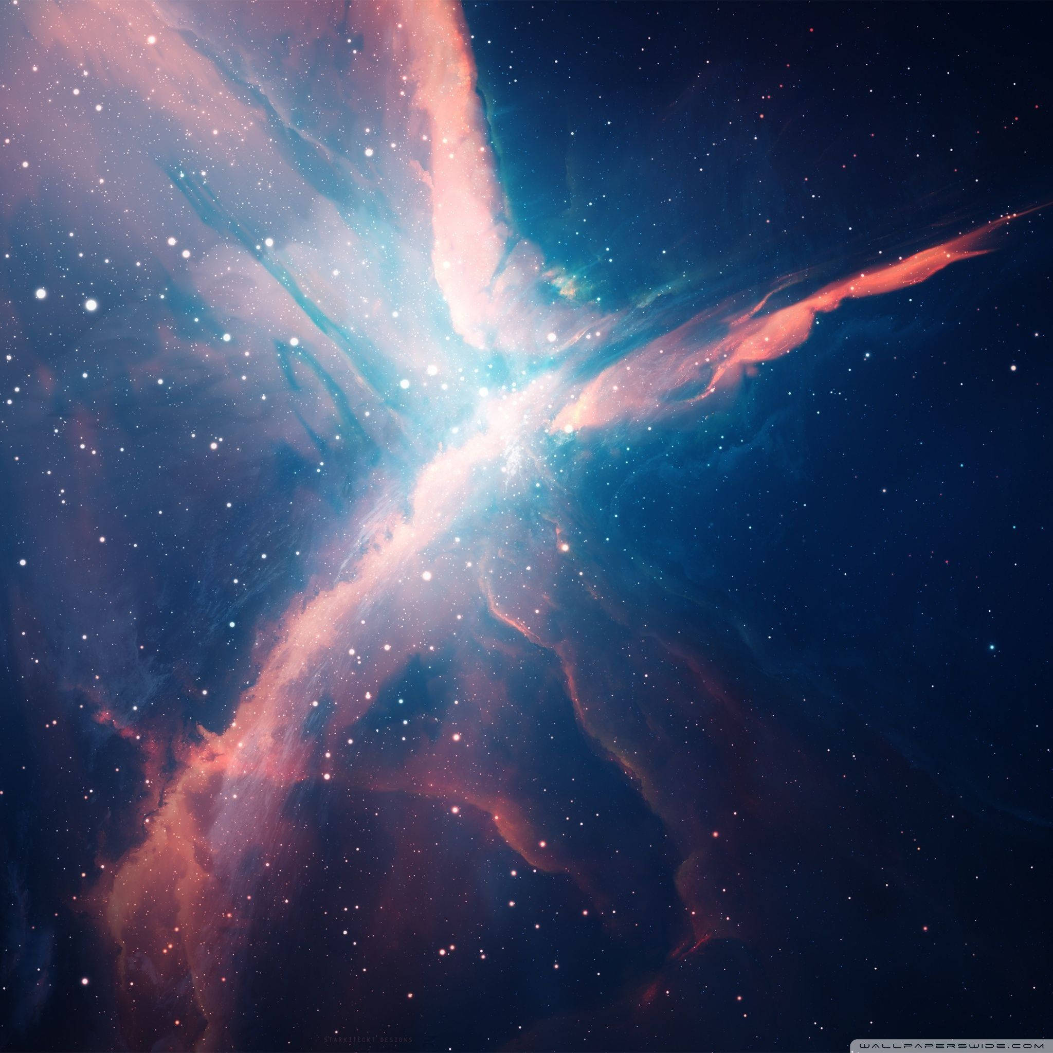 彩色動圖 桌布 壁紙 — 一個宇宙星雲在佈滿星辰的黑暗虛空中散發出充滿活力的粉紅色和藍色色調。