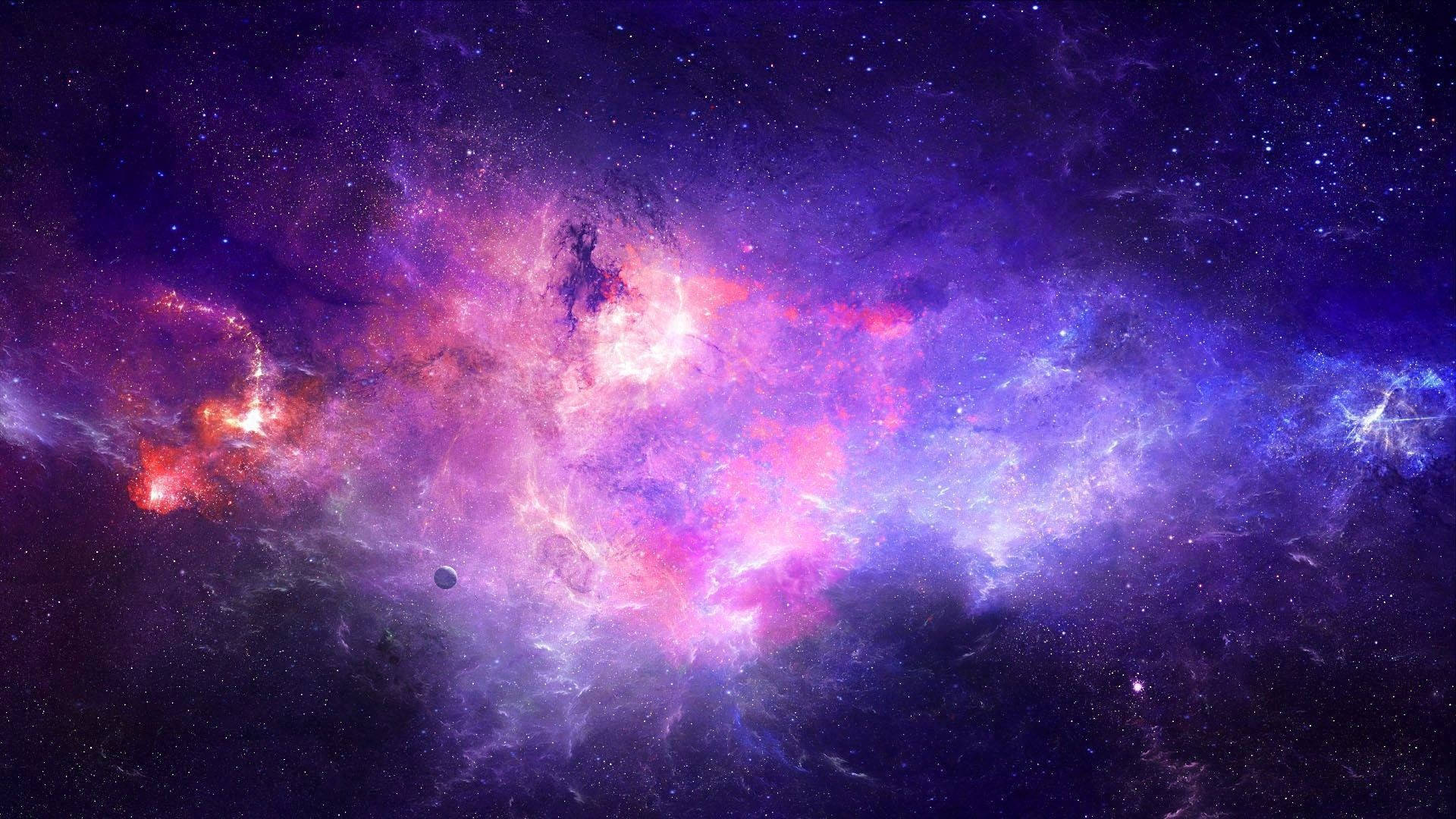 Tumblr Desktop 桌布 壁紙 — 一個宇宙星雲在充滿活力的紫色、粉紅色和紅色中旋轉，背景是星場，附近有一顆小行星漂流。