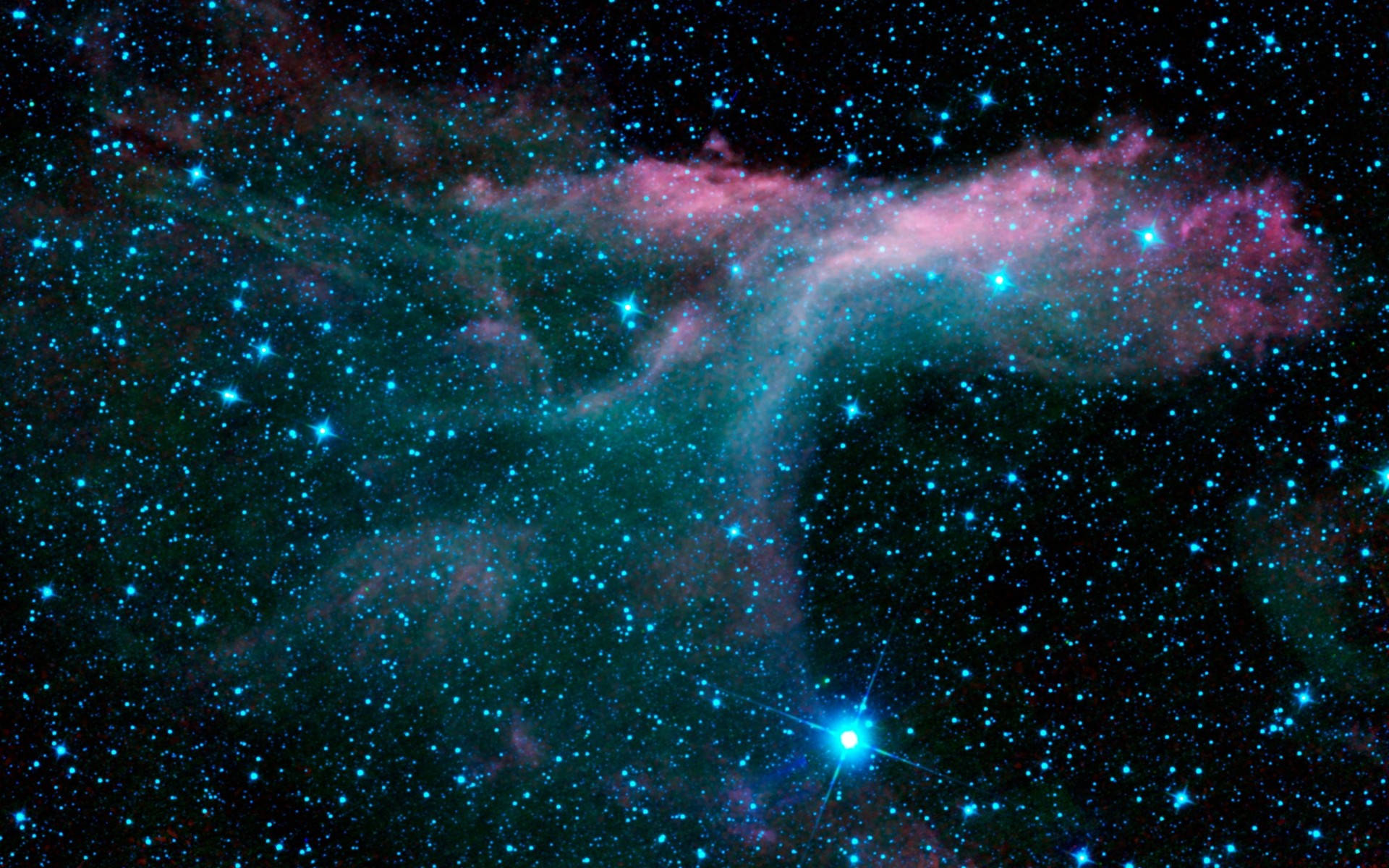 動態桌布 桌布 壁紙 — 一個宇宙星雲在充滿閃爍藍色星星的星場中，以鮮豔的青綠色和粉紅色旋轉。