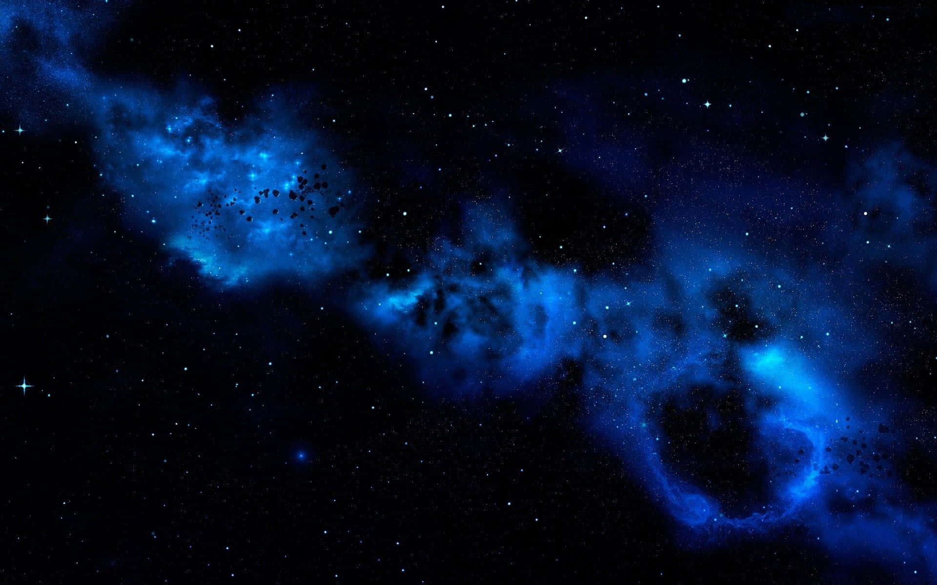 宇宙 桌布 壁紙 — 一個宇宙星雲在深藍色和黑色中旋轉，背景是外太空的星場。