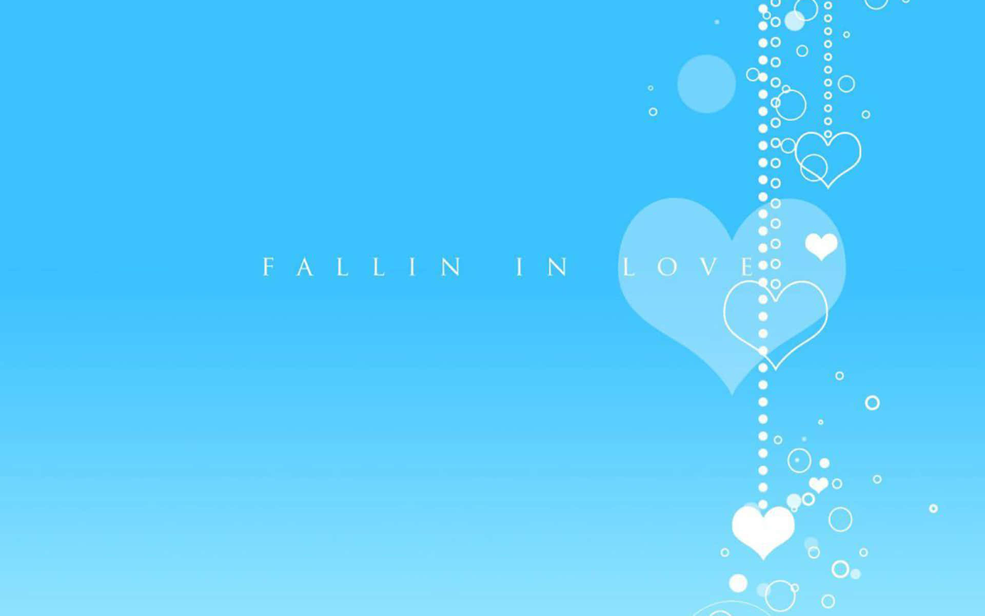 Pretty Blue 桌布 壁紙 — 一個寧靜的藍色漸層背景，白色愛心和氣泡在「FALLIN IN LOVE」文字旁邊向下流動。