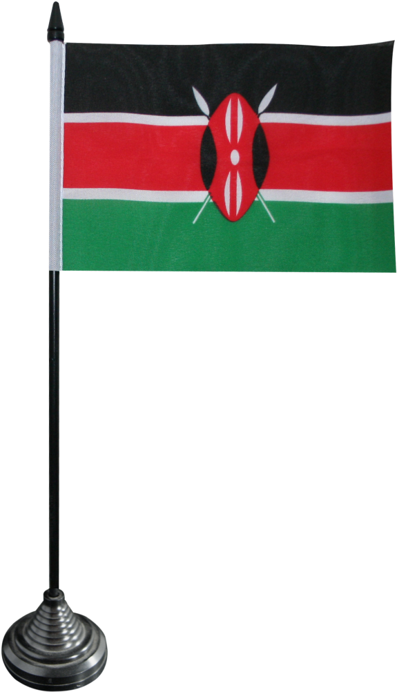 Kenya 桌布 壁紙 — 一個小型肯尼亞國旗放在黑色支架上，背景為純黑色，帶有鮮明的紅、綠、黑條紋和紅色盾牌徽章。