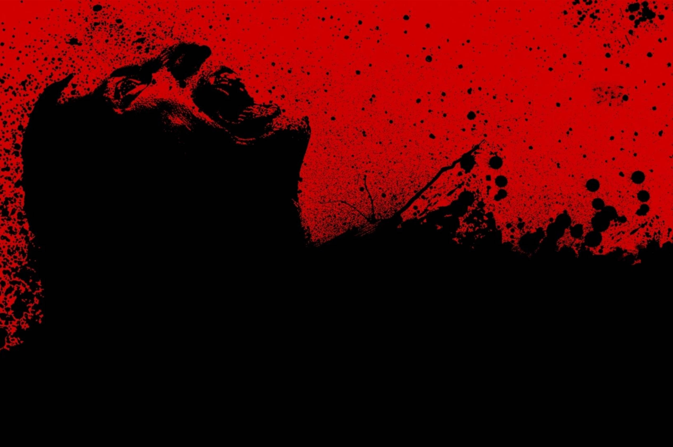 Blood 桌布 壁紙 — 一個尖叫面孔的鮮明黑色剪影，襯以鮮紅色的飛濺背景。