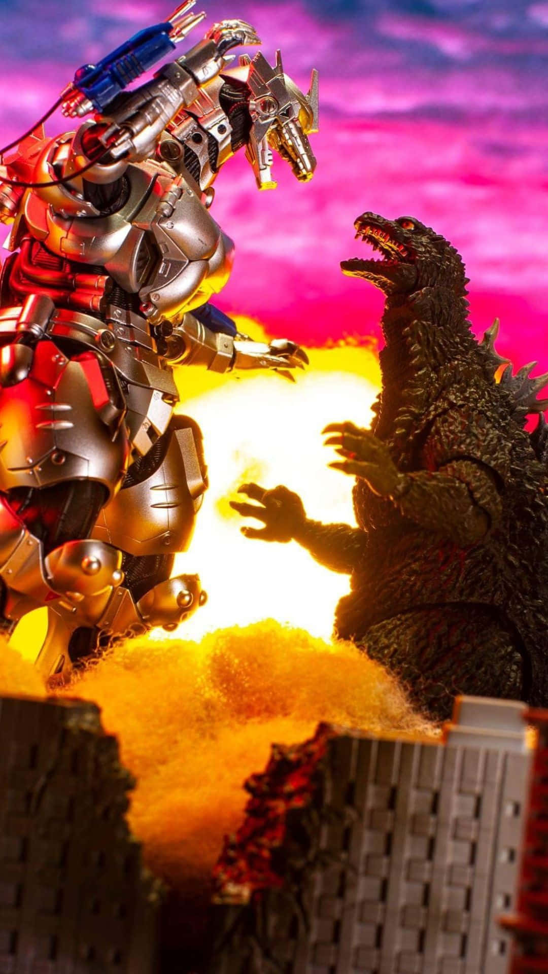 Godzilla Vs Mechagodzilla 桌布 壁紙 — 一個巨型機器人和哥吉拉在一個廢墟城市上空，在充滿活力的粉紅色和紫色天空下，於一場熾熱的爆炸中碰撞。