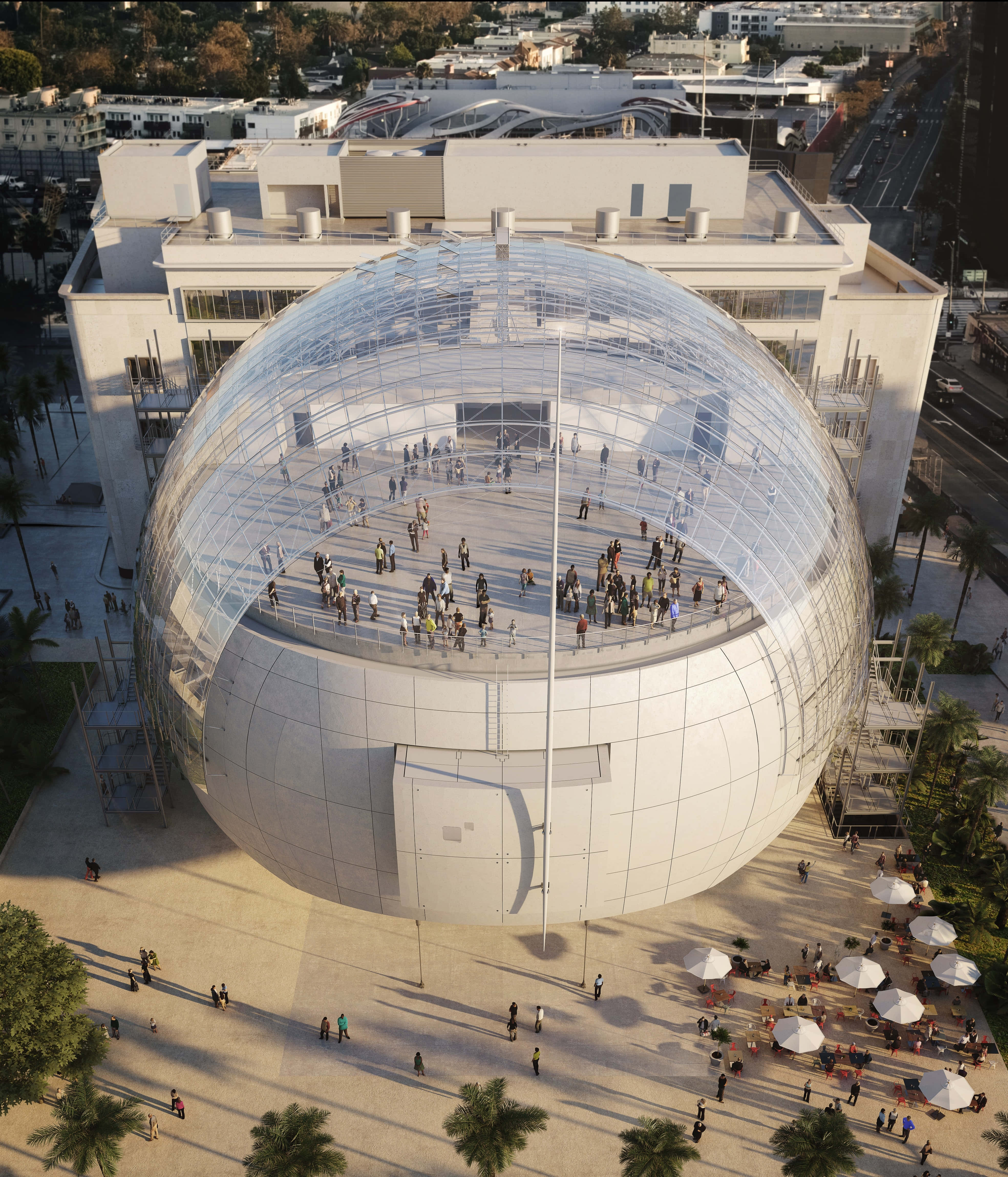 Museum 桌布 壁紙 — 一個巨大玻璃圓頂結構的鳥瞰圖，人們在其透明屋頂上行走，周圍環繞著棕櫚樹和城市建築。