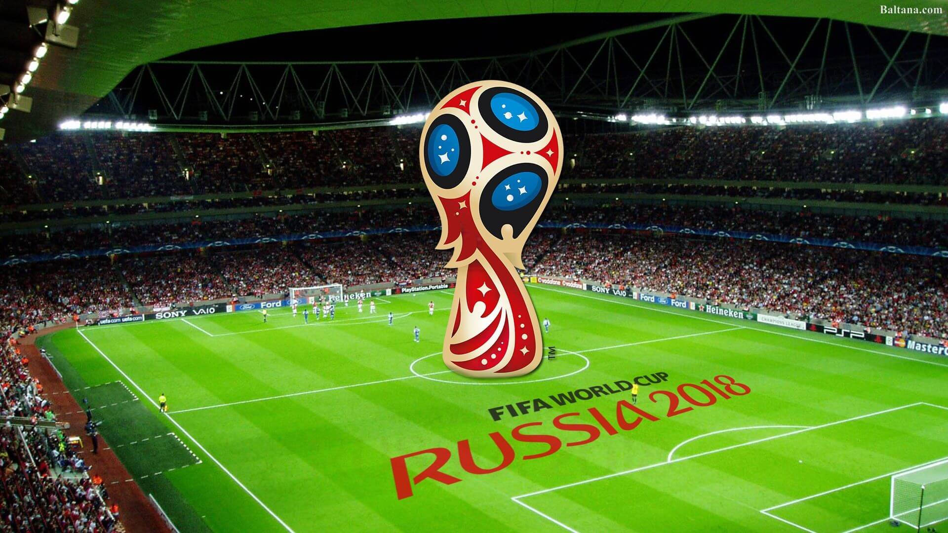 World 桌布 壁紙 — 一個巨大的FIFA世界盃獎盃矗立在充滿活力的綠色球場中央，周圍是擠滿觀眾的體育場看台，上方是明亮的泛光燈。