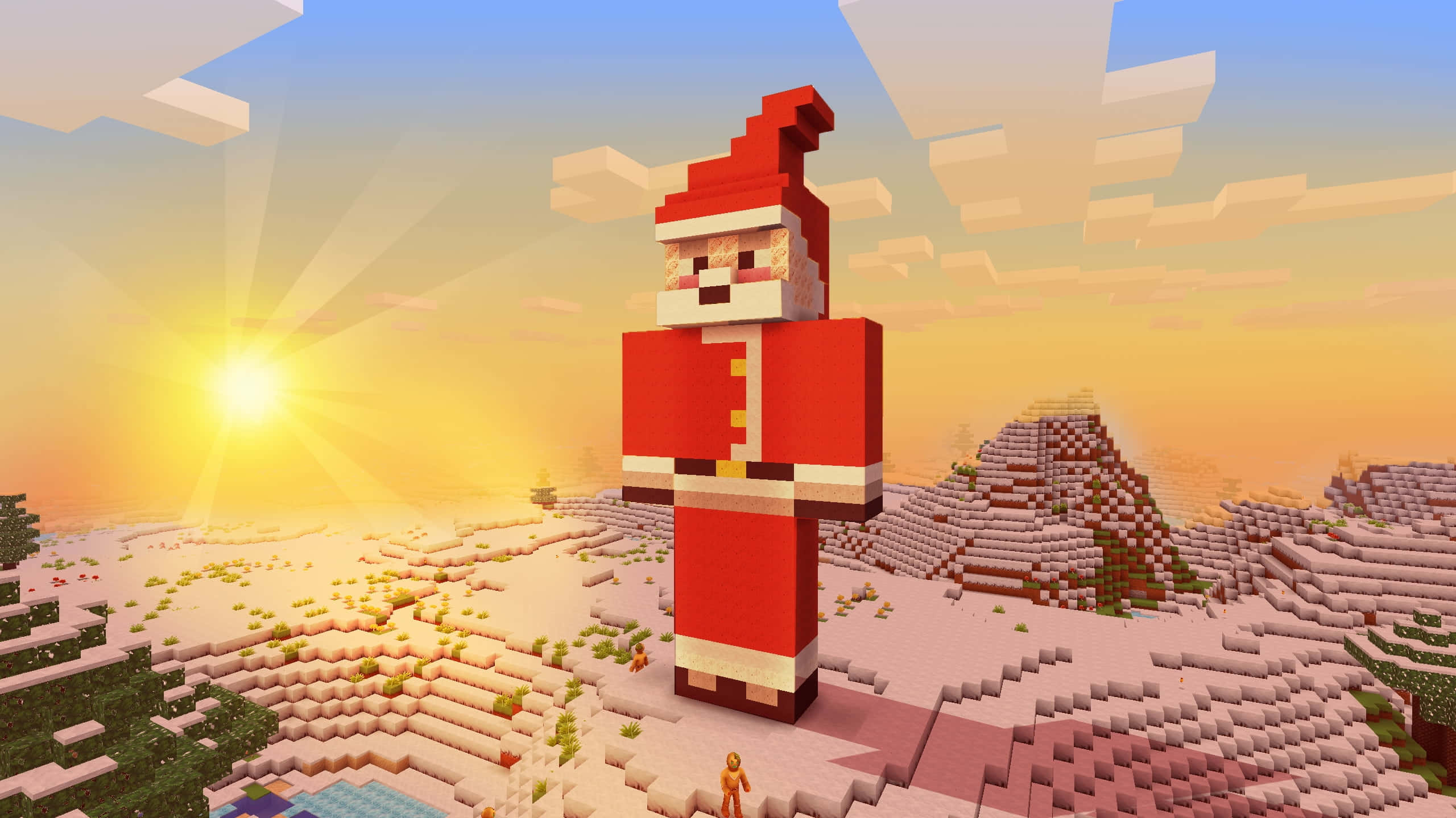 Minecraft Adventure 桌布 壁紙 — 一個巨大的像素化聖誕老人站在夕陽下，背景是方塊狀的沙漠景觀，有發光的太陽和風格化的雲朵。