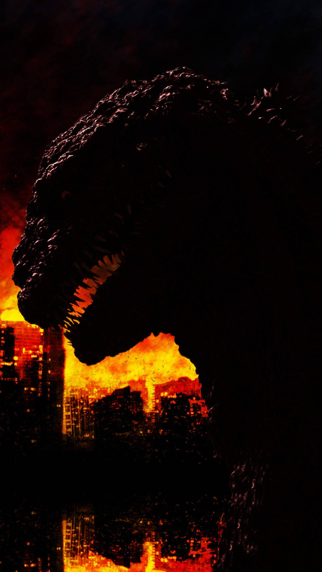 shin godzilla 桌布 壁紙 — 一個巨大的哥吉拉剪影在夜晚籠罩著燃燒的城市景觀，熾熱的橙色爆炸照亮了場景。