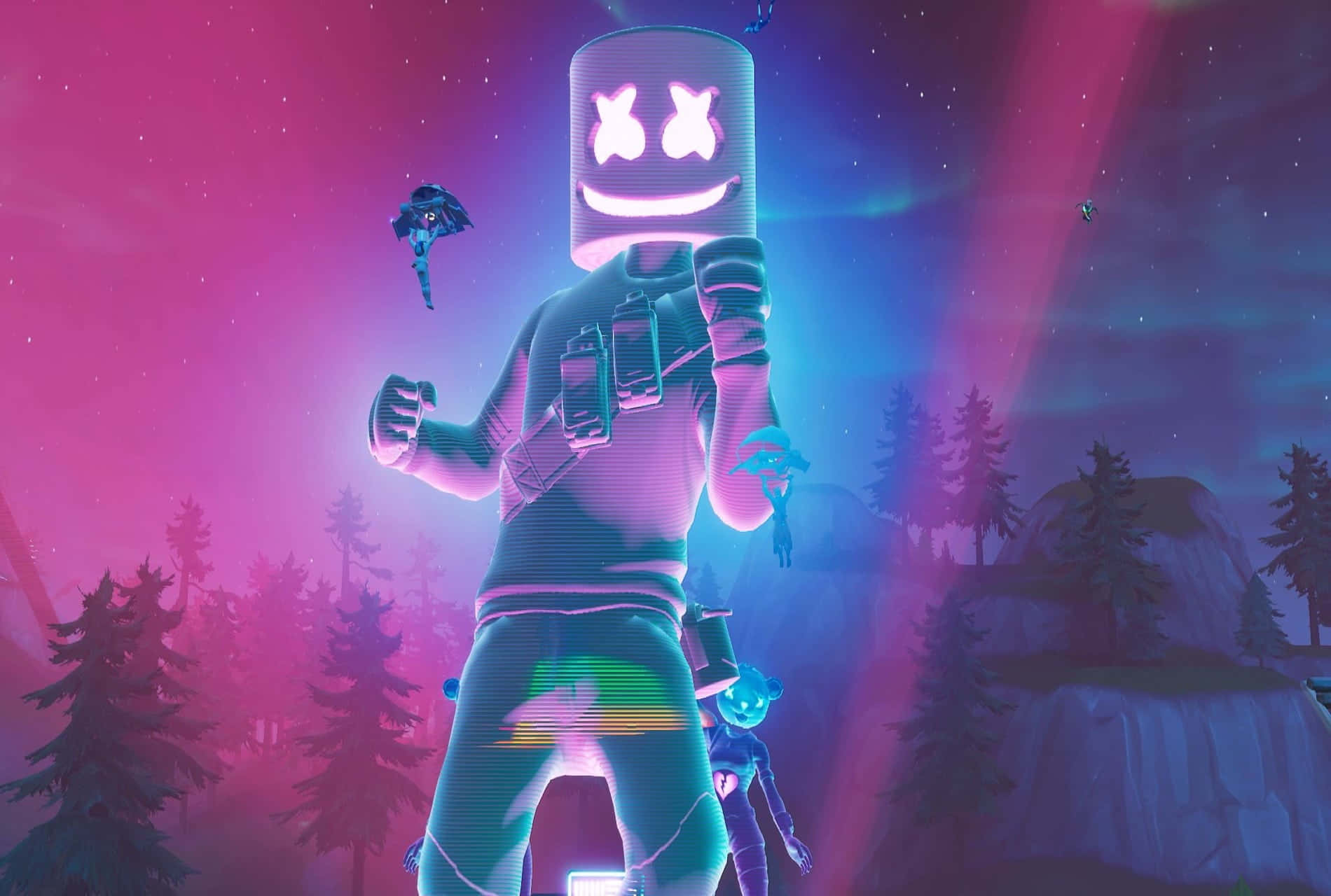 Fortnite Marshmello 桌布 壁紙 — 一個巨大的棉花糖頭角色，帶有發光的笑臉，站在霓虹燈森林中，星空下粉紅色和藍色的天空。