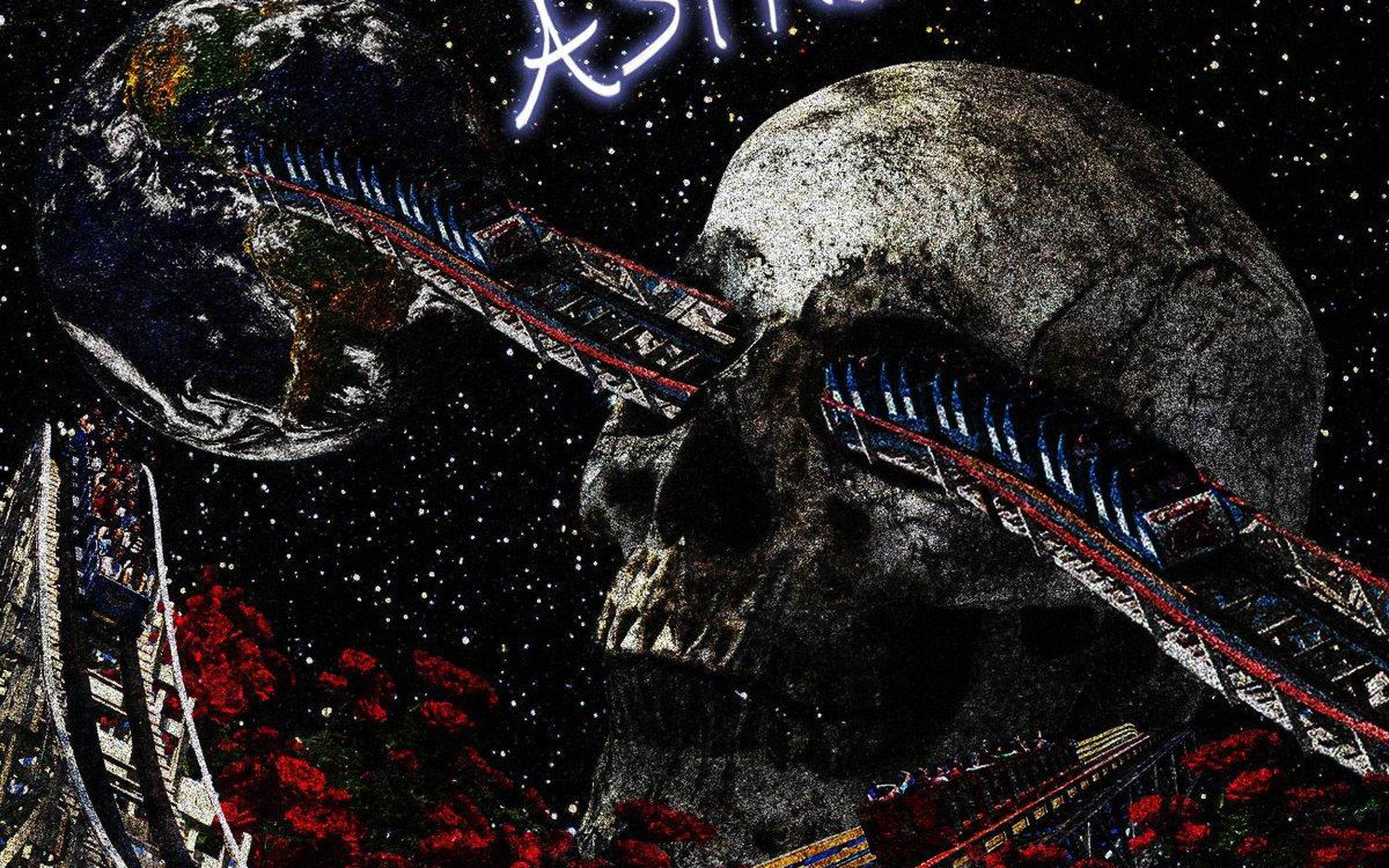 Astroworld 桌布 壁紙 — 一個巨大的頭骨，其眼窩和嘴巴中伸出雲霄飛車，背景是繁星點點的宇宙，地球就在附近。