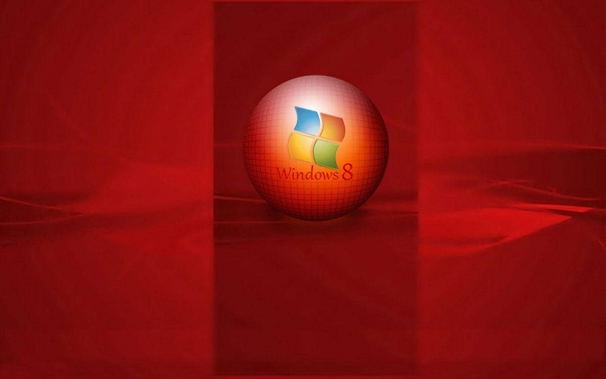 Red Color 桌布 壁紙 — 一個帶有光澤的Windows 8標誌球體，放置在深紅色布料表面上，光線柔和。