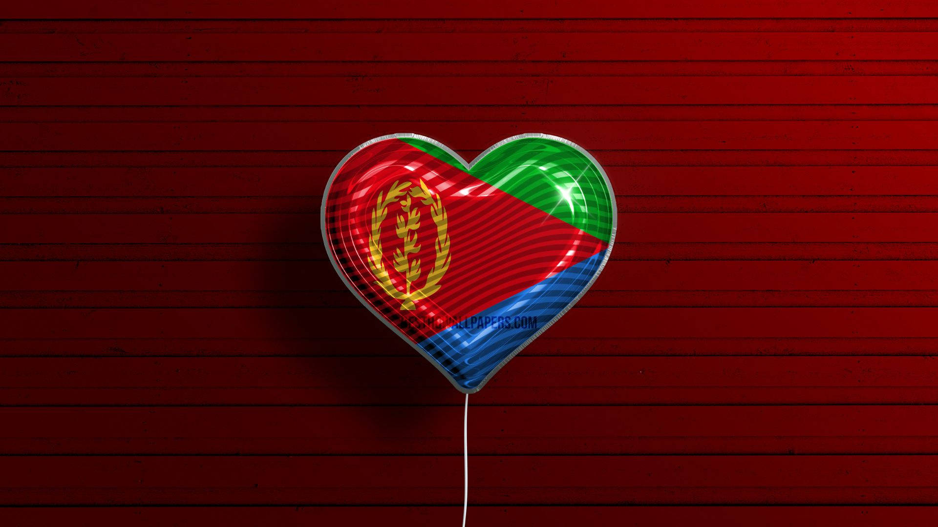 Eritrea 桌布 壁紙 — 一個帶有厄立特里亞國旗的光澤心形氣球漂浮在帶有紋理的紅色木質背景上。