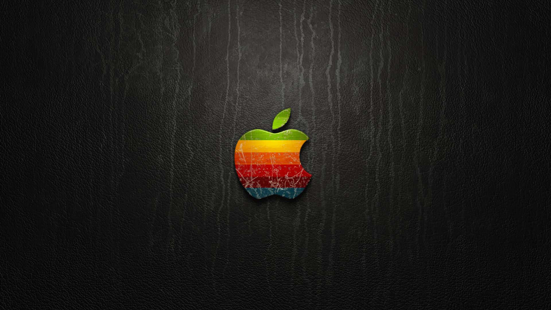 桌布 壁紙 — 一個帶有咬痕的復古彩虹Apple標誌居中放置在深色紋理皮革背景上。