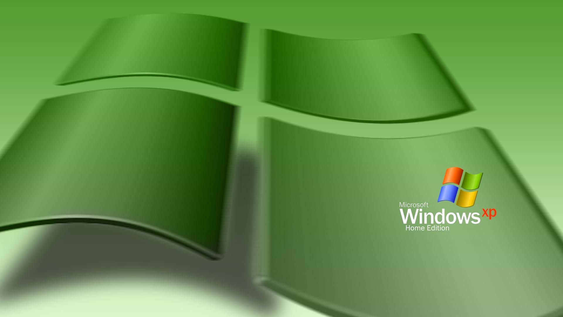 Windows XP 桌布 壁紙 — 一個帶有四個彎曲面板的光澤綠色Windows XP標誌，在漸變綠色背景上投射柔和陰影。