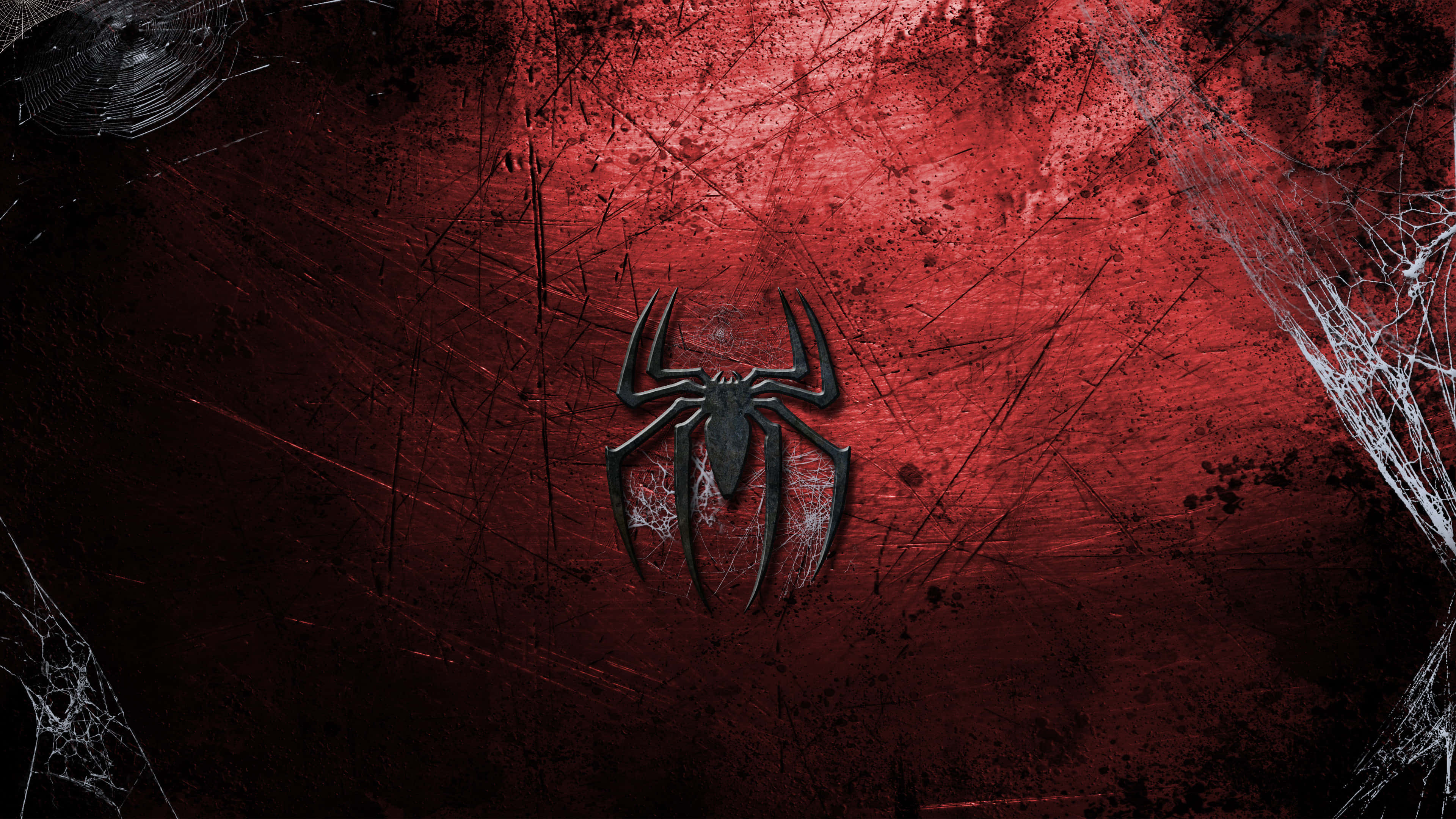 Spider Man Logo 桌布 壁紙 — 一個帶有威脅性的黑色蜘蛛標誌，位於粗糙的紅色牆壁中央，牆壁有裂紋紋理，角落有白色蜘蛛網。