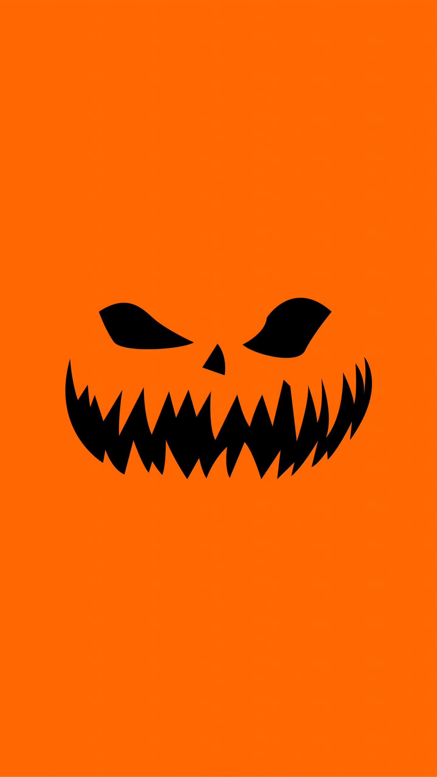 Minimalist Halloween 桌布 壁紙 — 一個帶有尖牙和瞇眼的威脅性黑色傑克南瓜燈面孔，在純橙色背景上凝視。