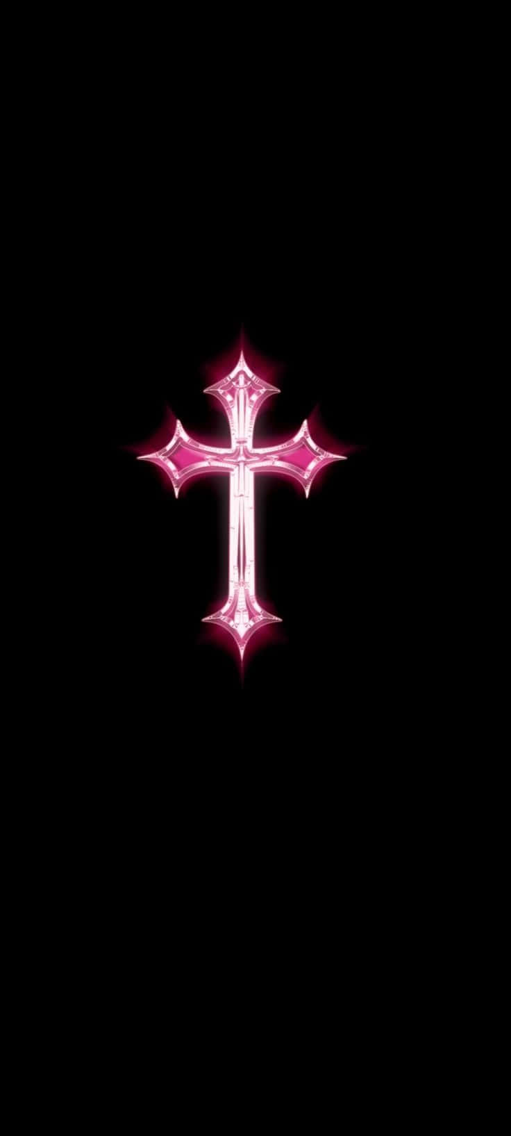 Pink Cross 桌布 壁紙 — 一個帶有尖銳頂端的發光粉紅色十字架，位於純黑色背景的中央。