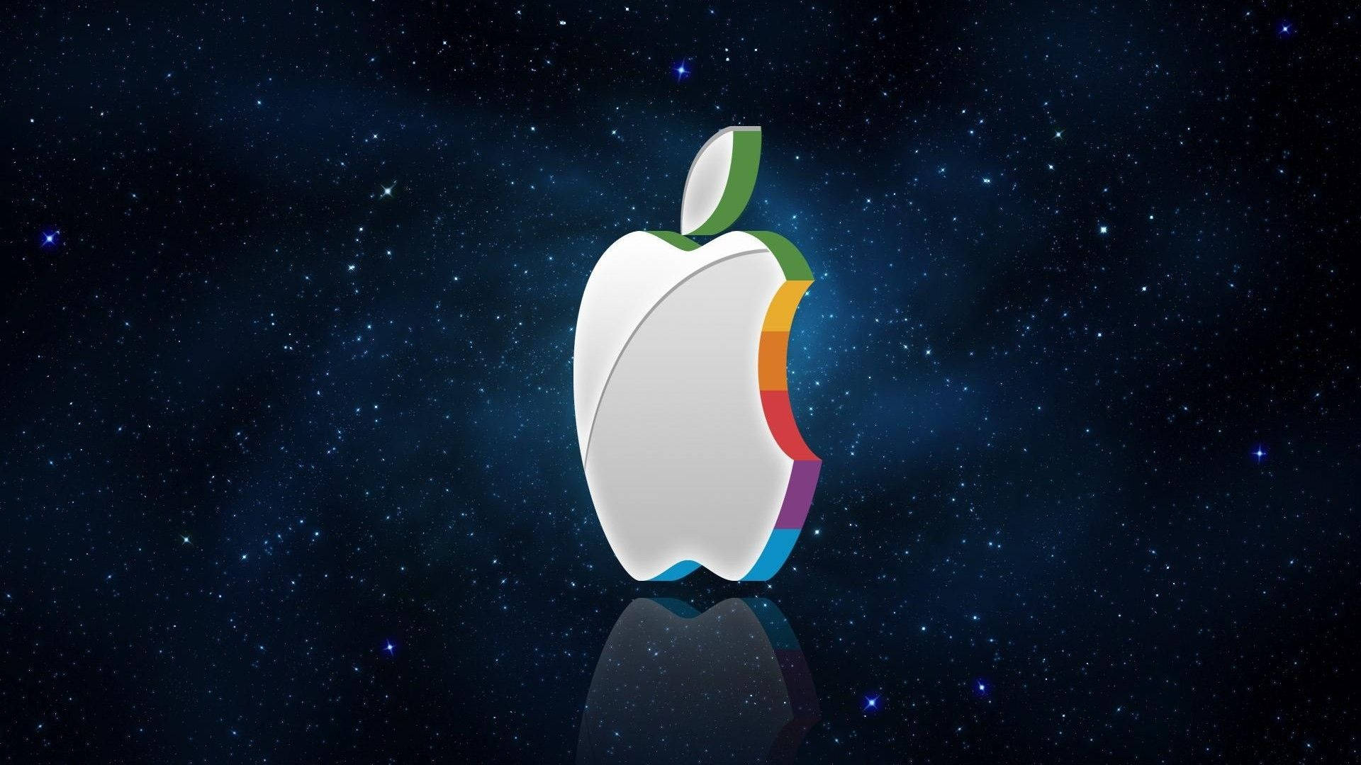 桌布 壁紙 — 一個帶有彩虹咬痕的光澤Apple標誌漂浮在星空宇宙背景上，下方有反射表面。