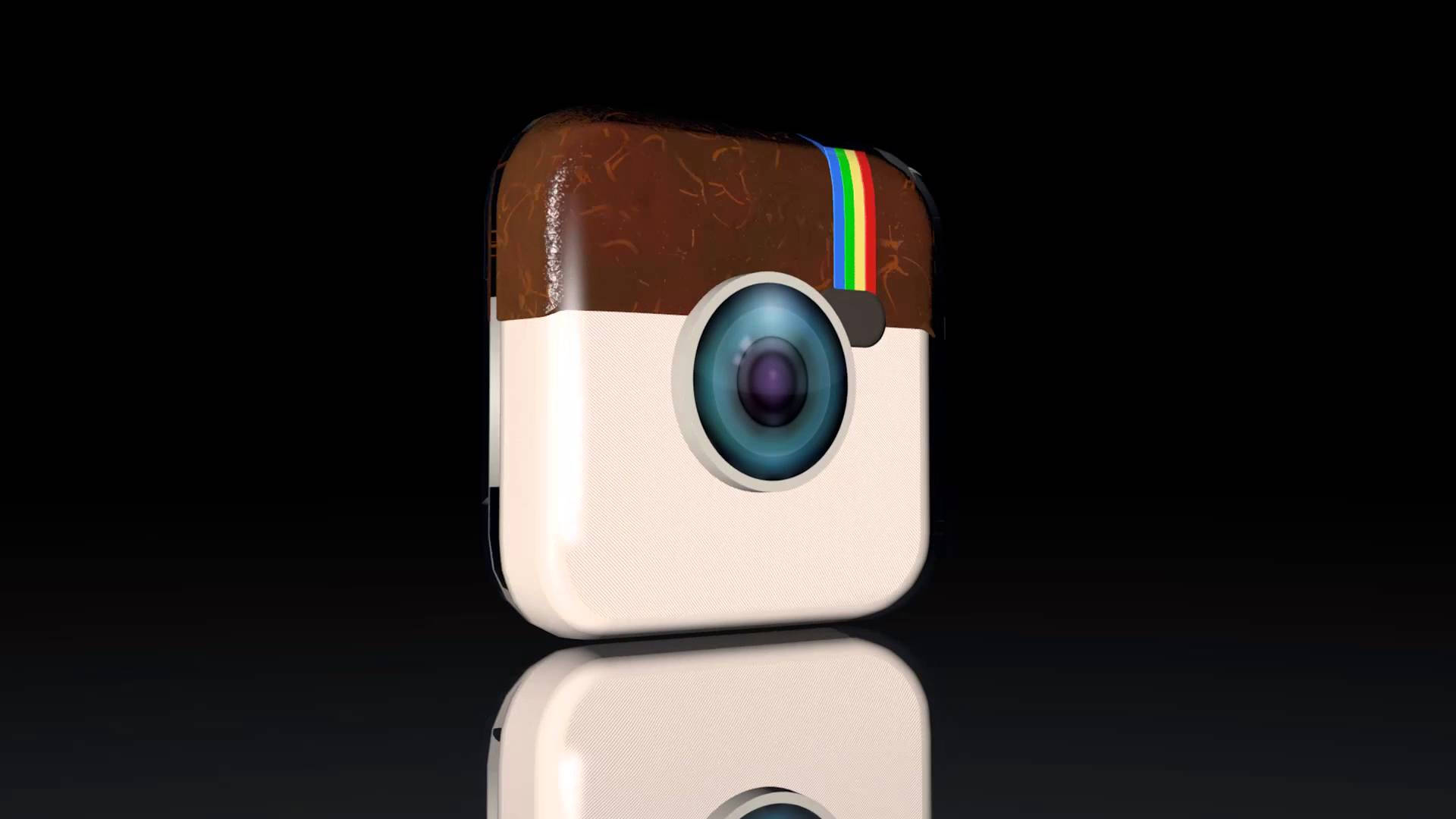Instagram 桌布 壁紙 — 一個帶有彩虹條紋和裂開棕色頂部的光面Instagram相機圖標，位於反光黑色表面上。