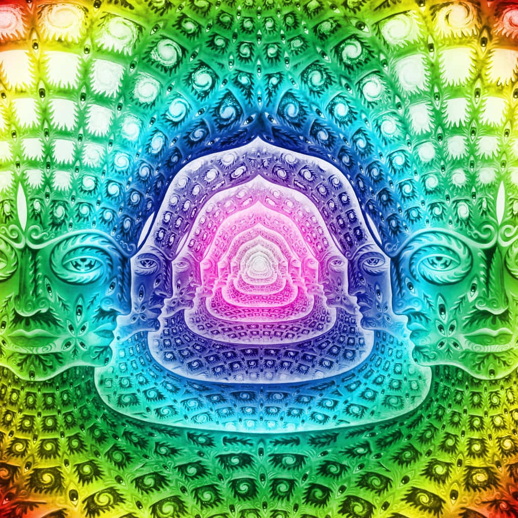 Trippy Fractals 桌布 壁紙 — 一個帶有彩虹色調和重複眼睛圖案的迷幻碎形曼陀羅，從中央發光的螺旋向外輻射。