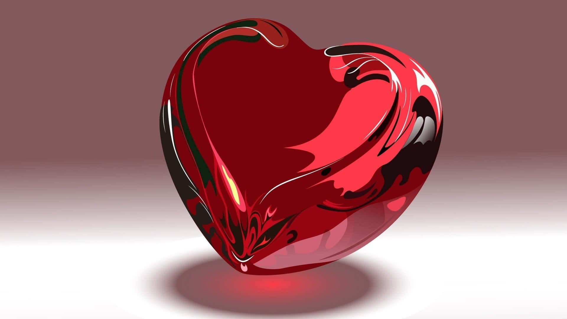 Red Heart 桌布 壁紙 — 一個帶有旋轉黑色圖案的亮面紅色心形物體，漂浮在柔和的漸變背景上。