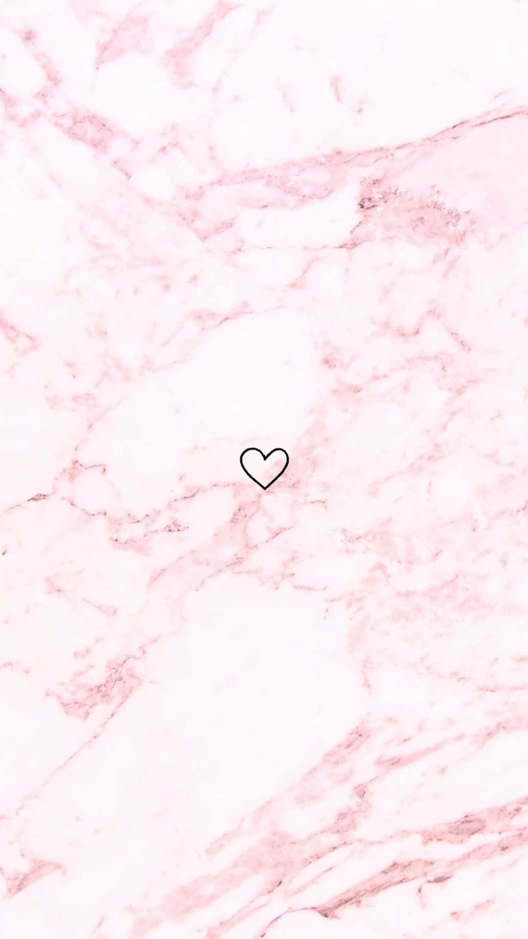 Heart Outline 桌布 壁紙 — 一個帶有柔和紋理的精緻粉紅色大理石背景，中央放置了一個極簡風格的黑色心形。