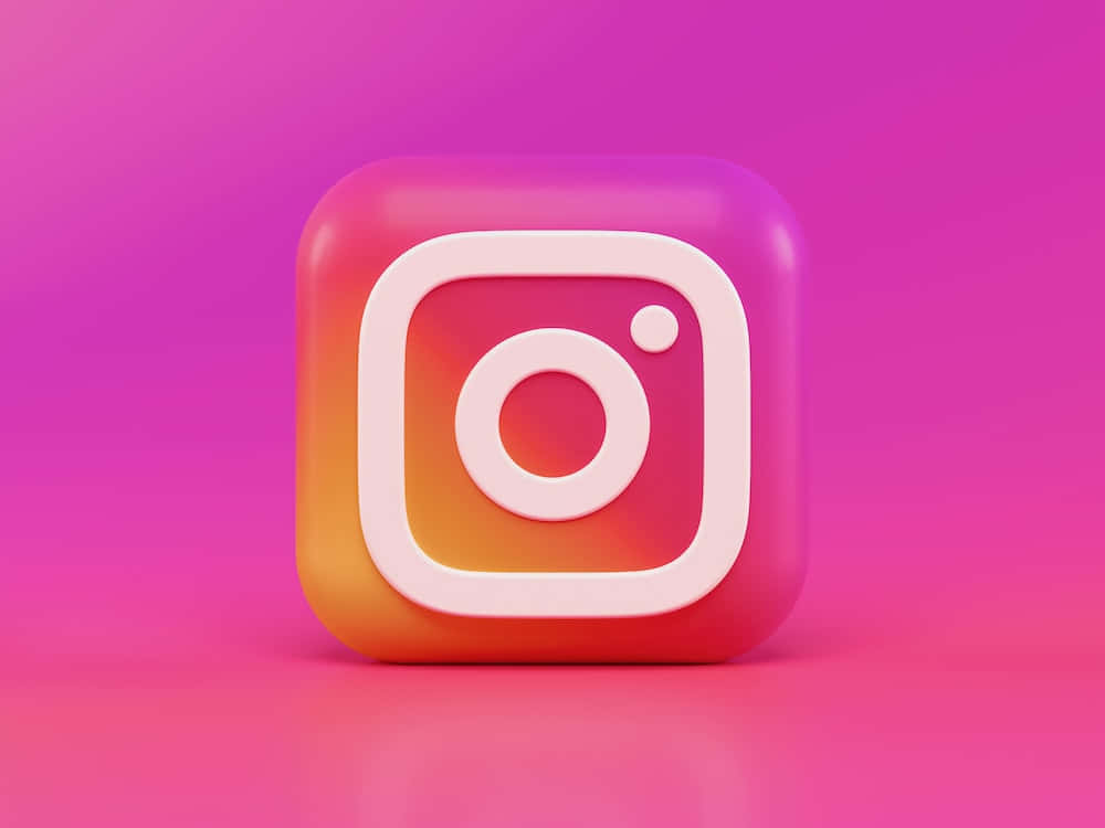 Instagram 桌布 壁紙 — 一個帶有漸變橙粉紅色調的光澤3D Instagram標誌圖示，居中在充滿活力的粉紅色背景上。