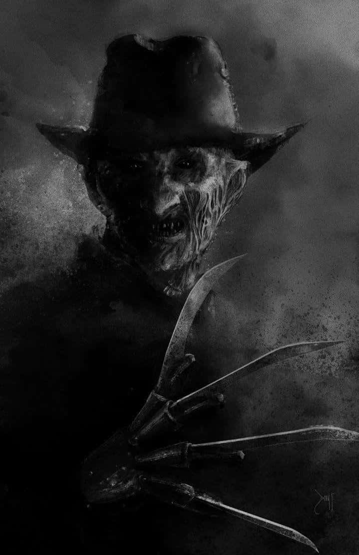 Freddy Krueger 桌布 壁紙 — 一個帶有燒焦面孔和刀片手的威脅性佛萊迪·克魯格從煙霧瀰漫的黑暗中浮現，呈現粗糙的黑白肖像。