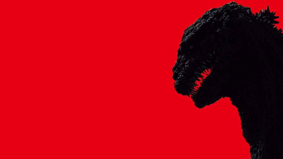 godzilla 1998 桌布 壁紙 — 一個帶有發光紅色牙齒的威脅性黑色哥吉拉剪影，背景為純紅色。