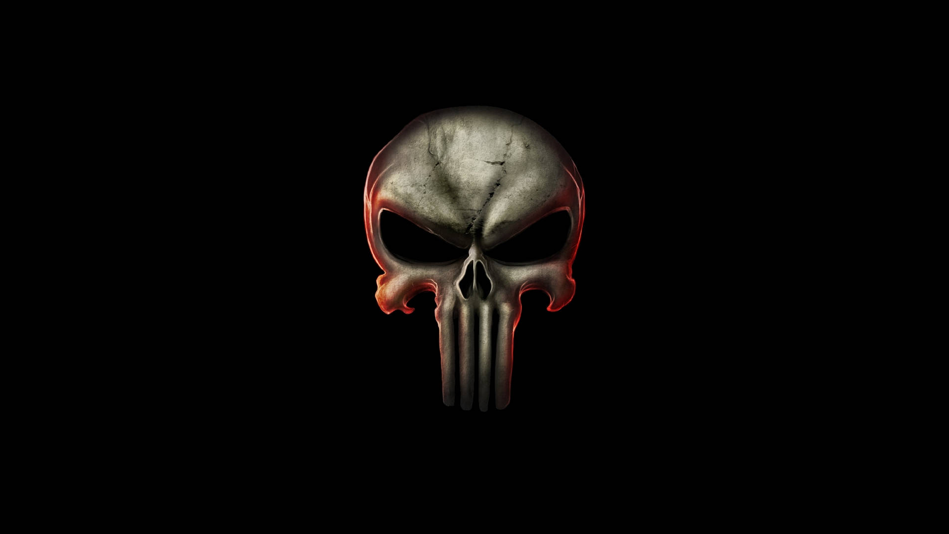 Punisher Logo 桌布 壁紙 — 一個帶有發光紅色邊緣的威脅性金屬骷髏頭，居中於純黑色背景上。