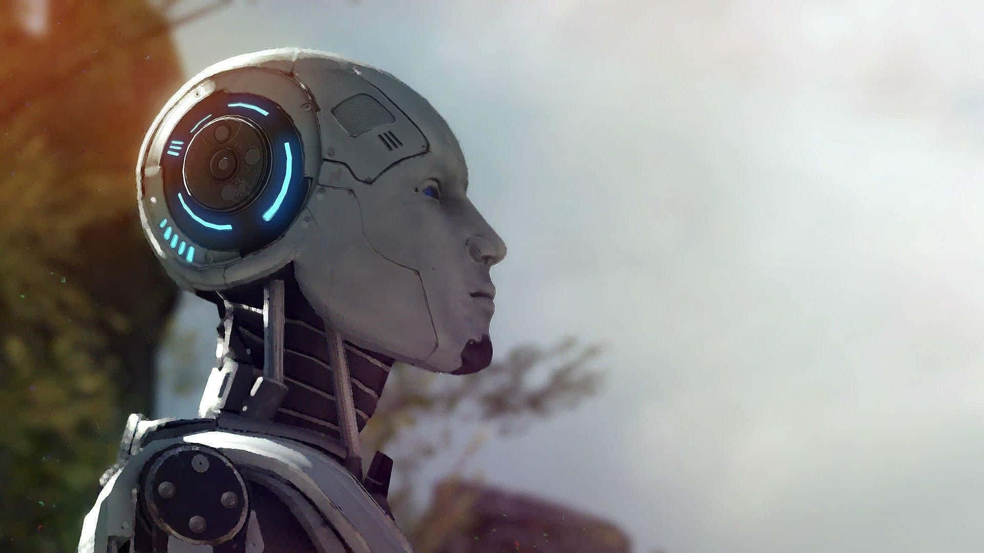 Robot 桌布 壁紙 — 一個帶有發光藍色圓形頭燈的人形機器人，在柔和模糊的自然背景下若有所思地凝視著。