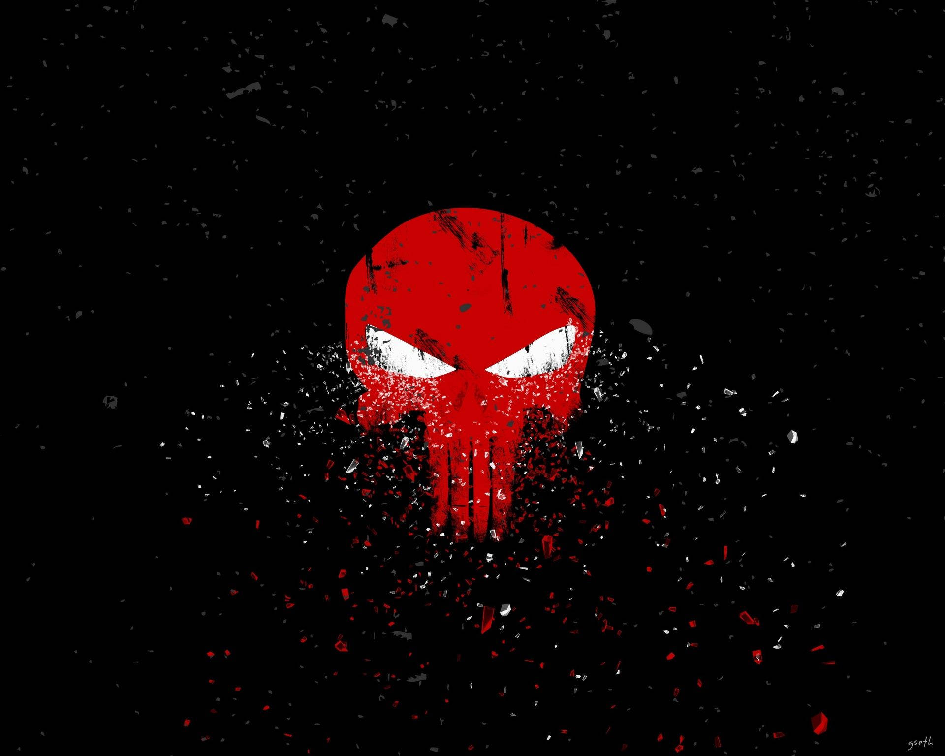 Punisher Logo 桌布 壁紙 — 一個帶有白色眼睛的粗糙紅色頭骨從黑色混亂中爆裂出來，濺滿紅色和白色的碎片。