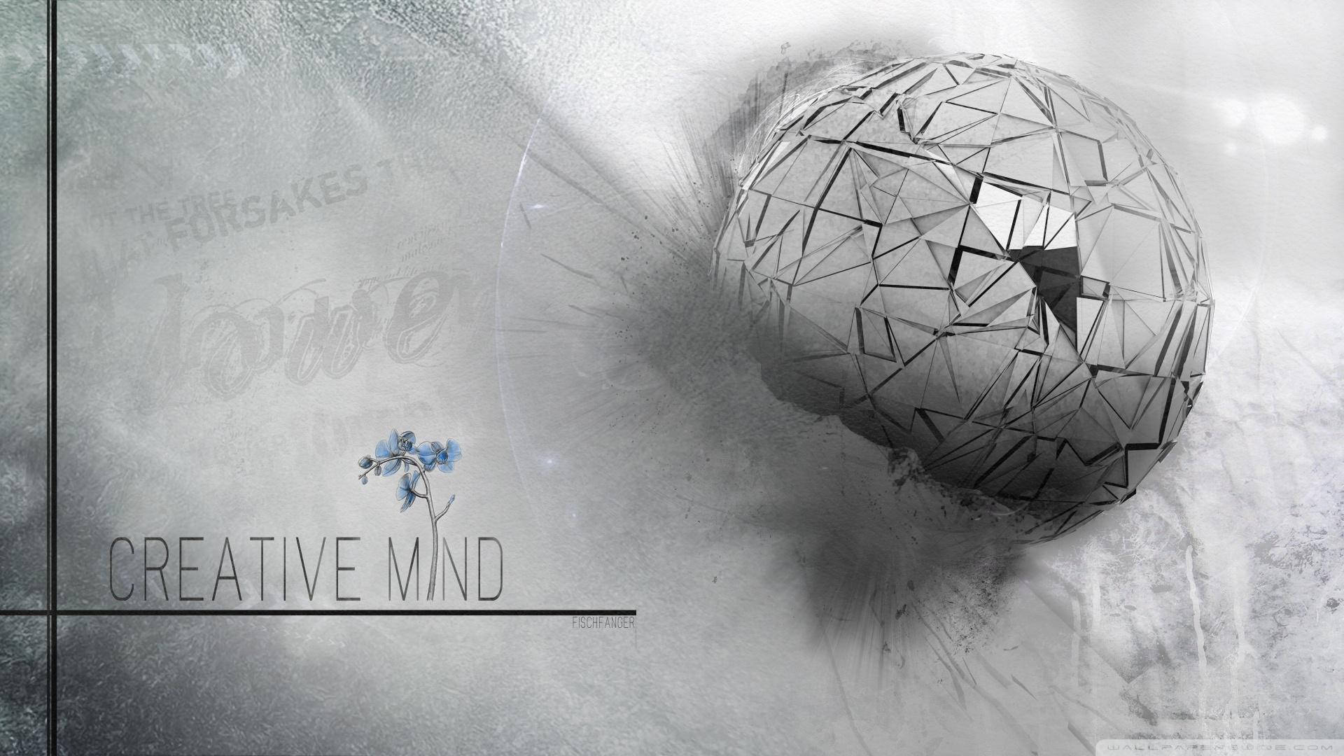 Brain 桌布 壁紙 — 一個帶有破碎切面的幾何球體在旋轉的灰色薄霧中漂浮，旁邊是一朵精緻的藍色花朵和文字 creative mind。