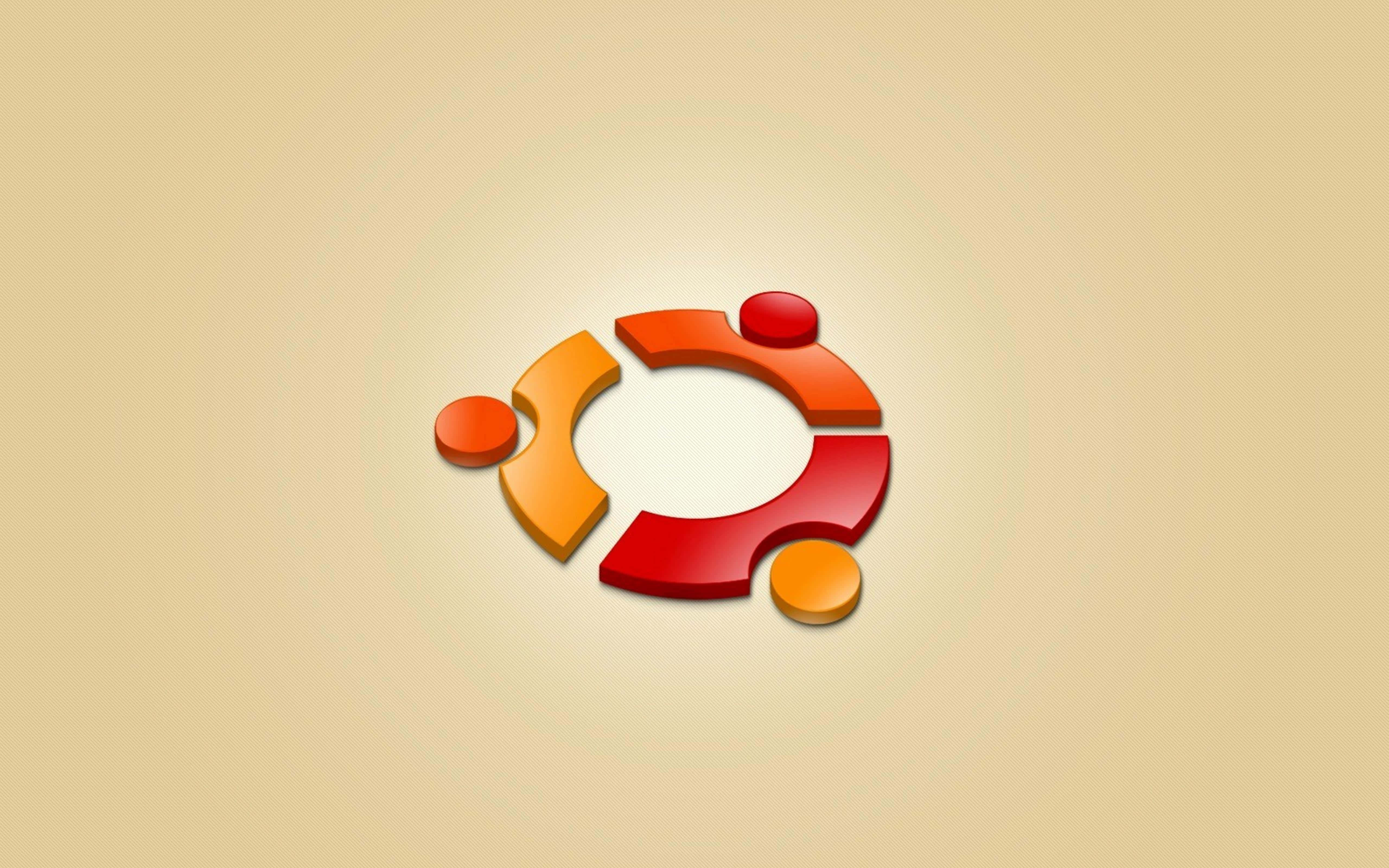 ubuntu 桌布 壁紙 — 一個帶有紅色、橙色和黃色部分的 3D Ubuntu 標誌漂浮在柔和的米色背景上。