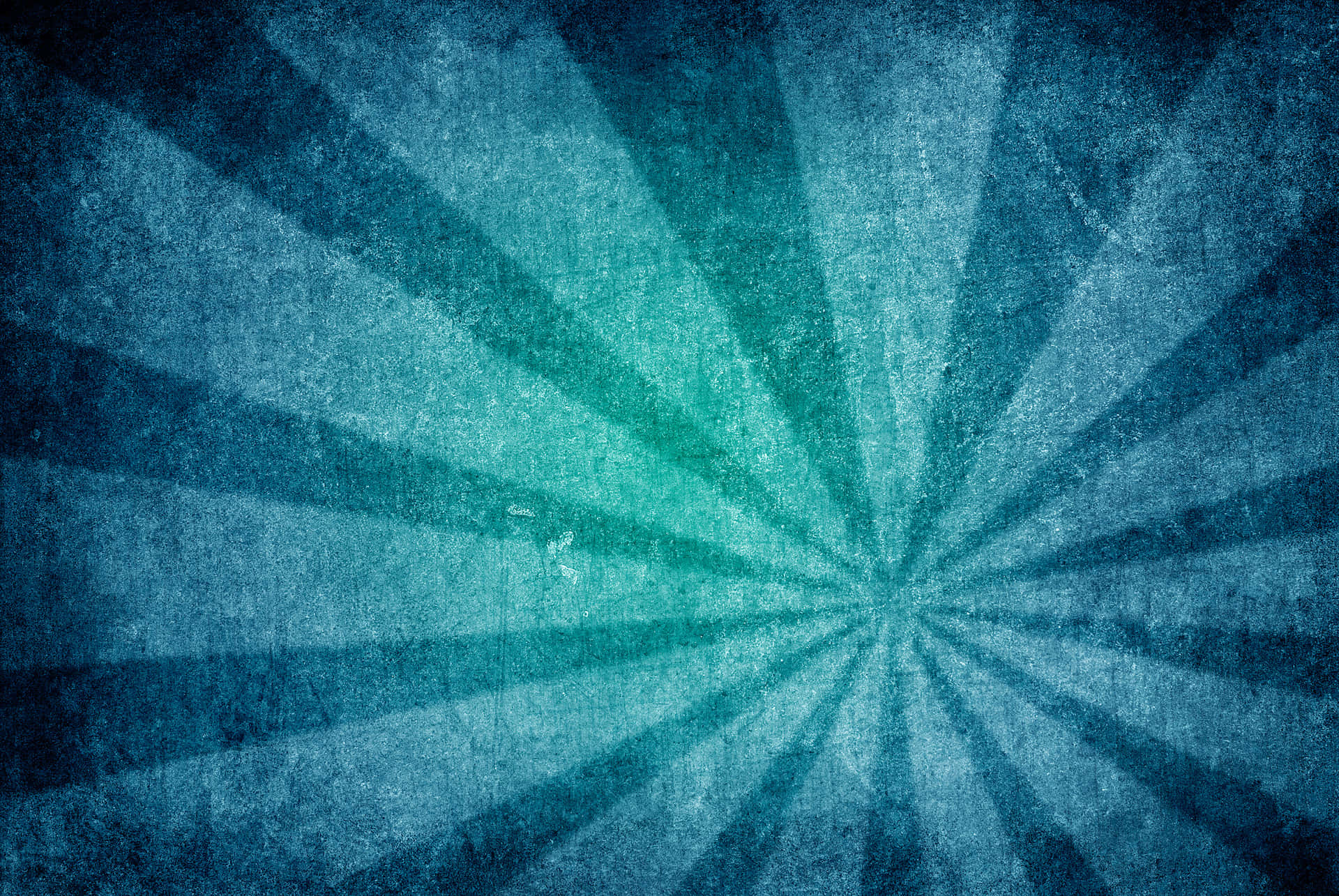 圖案 桌布 壁紙 — 一個帶有紋理的藍色放射狀爆裂圖案，帶有從中心點散發的復古垃圾效果。
