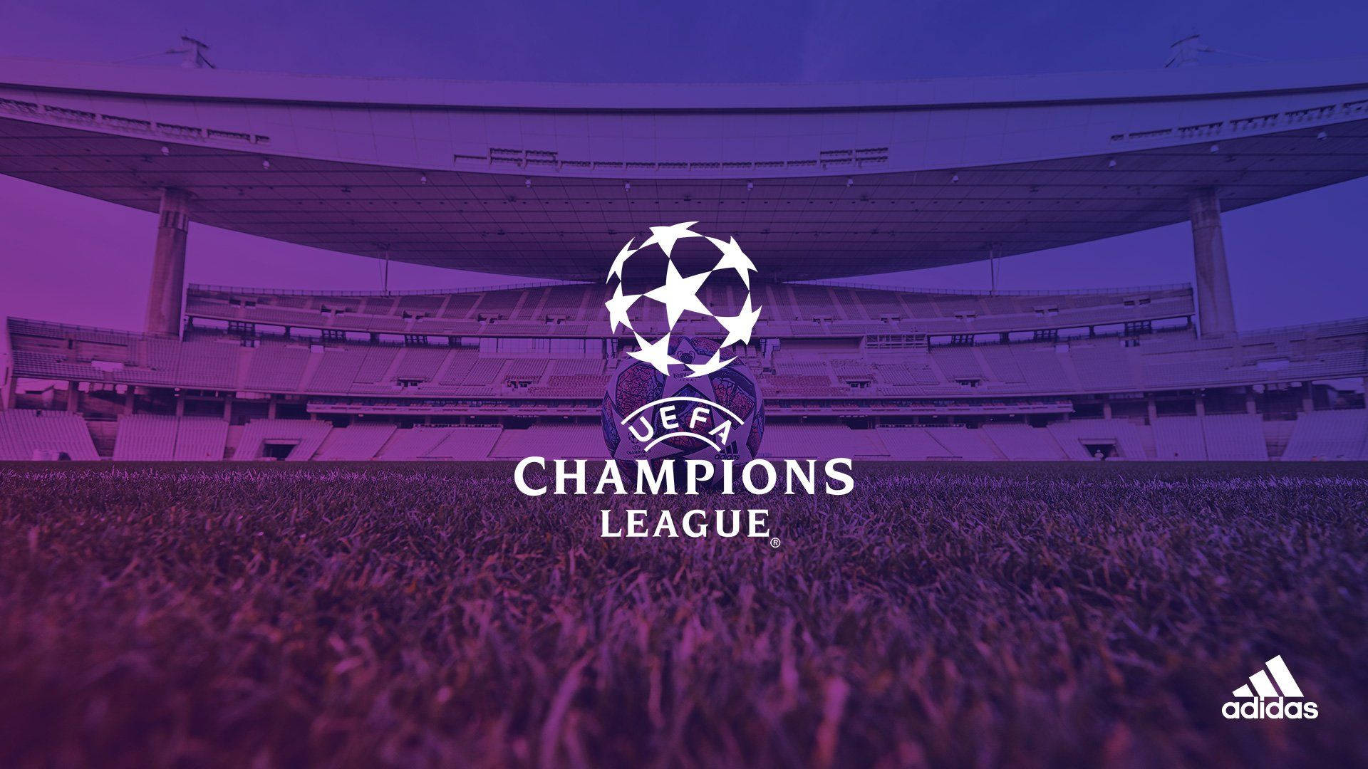 Uefa 桌布 壁紙 — 一個帶有紫色調的足球場，草地中央有 UEFA 歐冠聯賽標誌。
