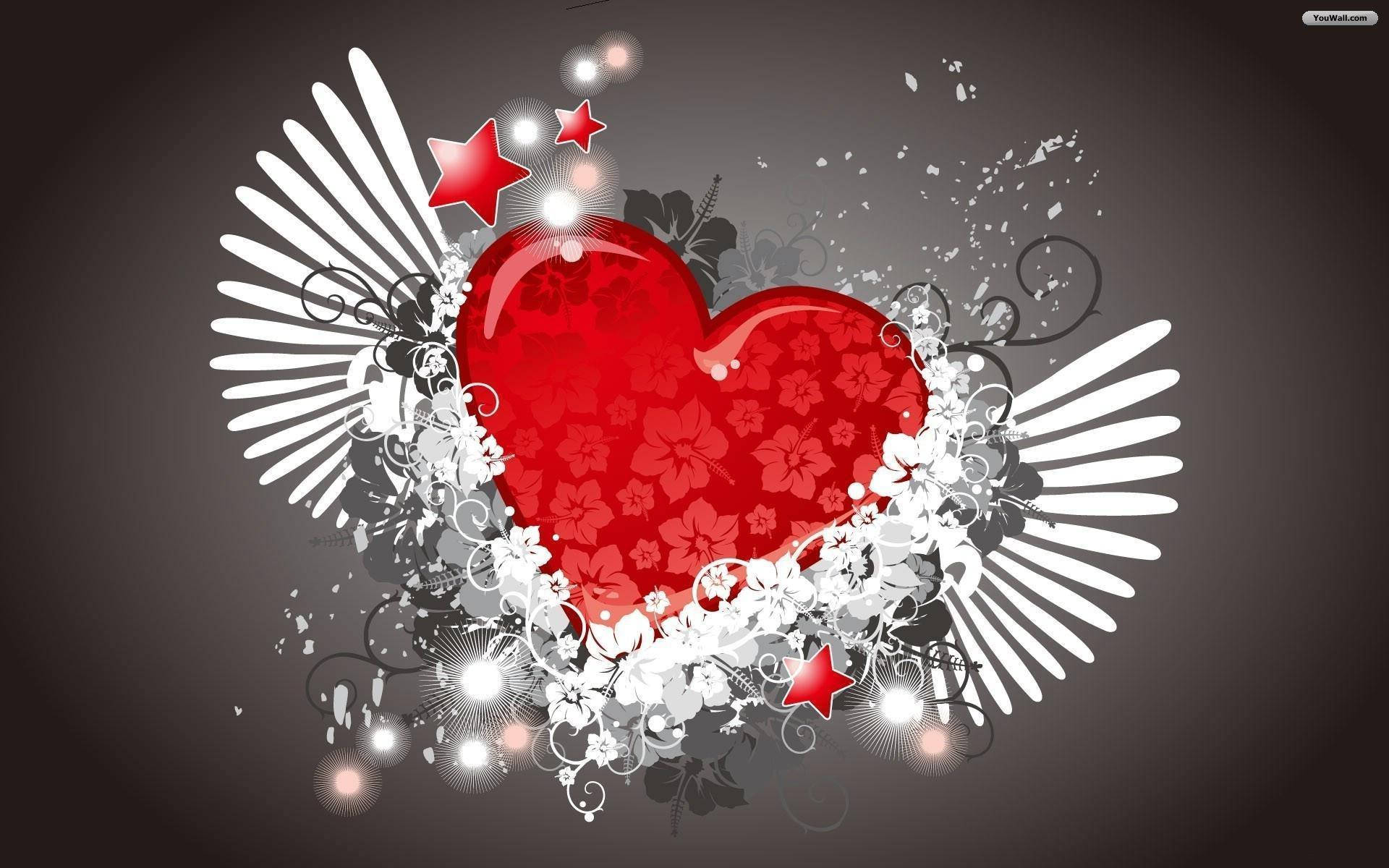 Love Heart 桌布 壁紙 — 一個帶有花卉圖案和白色翅膀的光澤紅心，被星星和漩渦環繞在深灰色背景上。