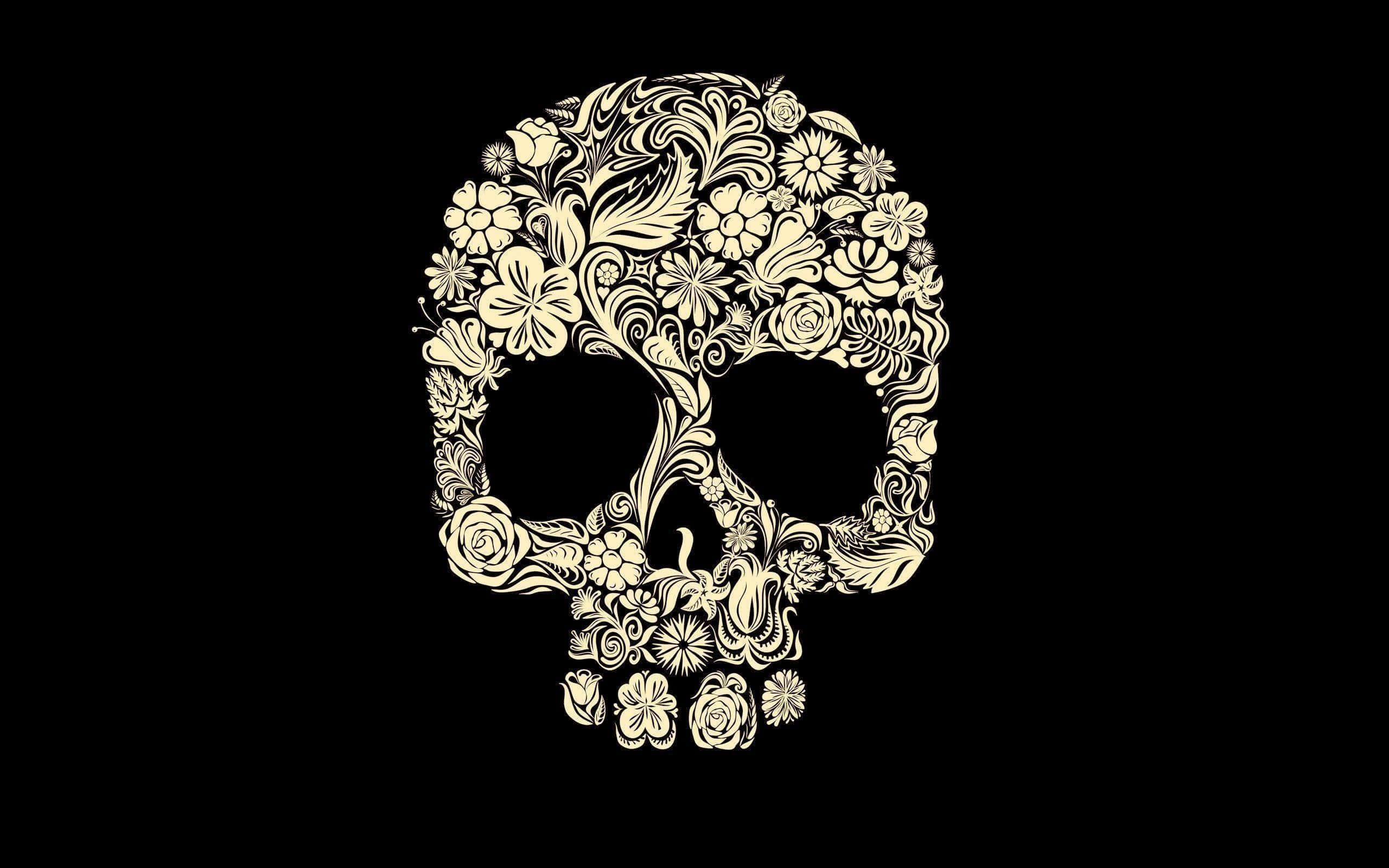 Girly Skull 桌布 壁紙 — 一個帶有複雜花卉圖案的奶油色華麗頭骨，在純黑色背景上脫穎而出。