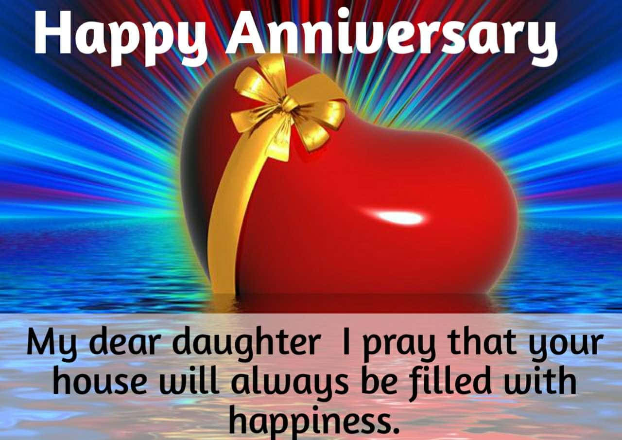Anniversary 桌布 壁紙 — 一個帶有金色蝴蝶結的光澤紅色心形禮物，在漣漪的水面上散發出五彩繽紛的光束。