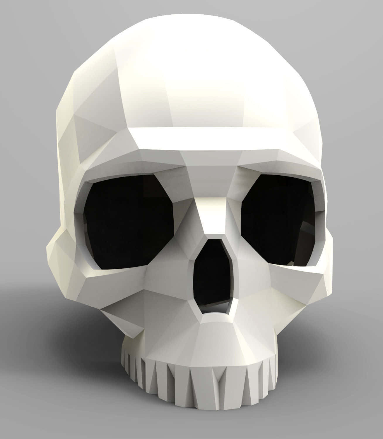 3d Skull 桌布 壁紙 — 一個帶有銳利幾何切面和空洞眼窩的白色低多邊形骷髏頭，矗立在中性灰色背景前。