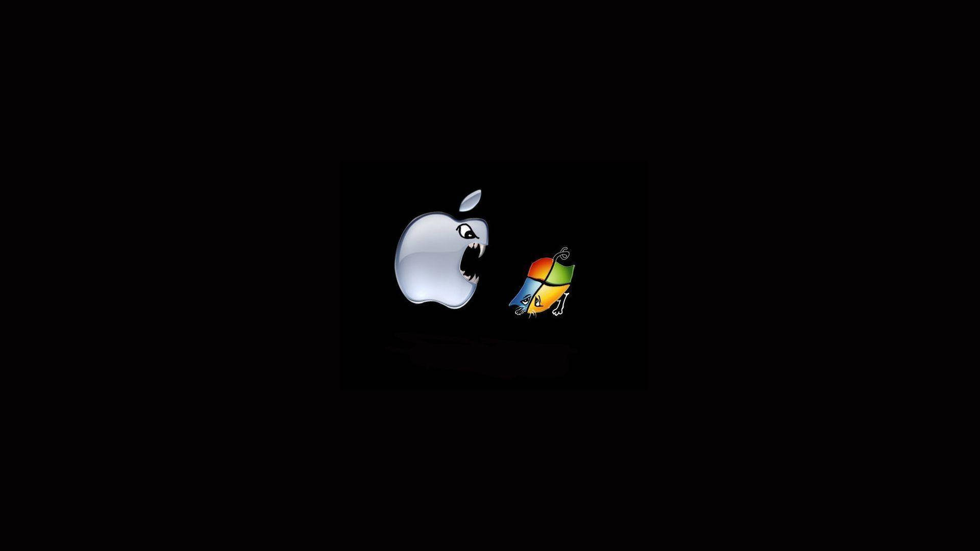搞笑筆電 桌布 壁紙 — 一個帶有露齒的威脅性Apple標誌，在黑色背景上與一個細小色彩繽紛的Mac OS X標誌對峙。