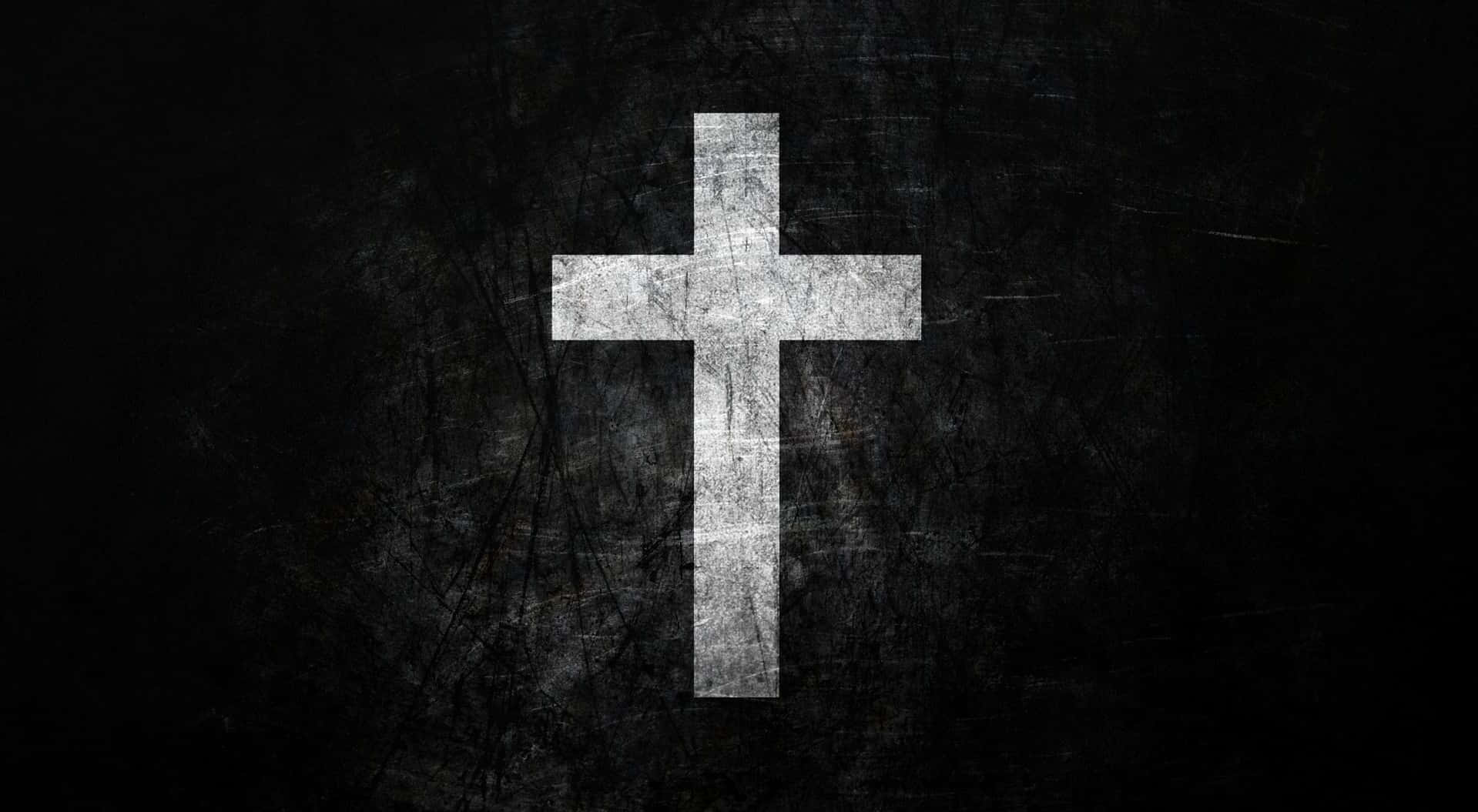 Cool Cross 桌布 壁紙 — 一個帶有風化紋理的白色十字架，在黑暗粗糙的背景中居中豎立。