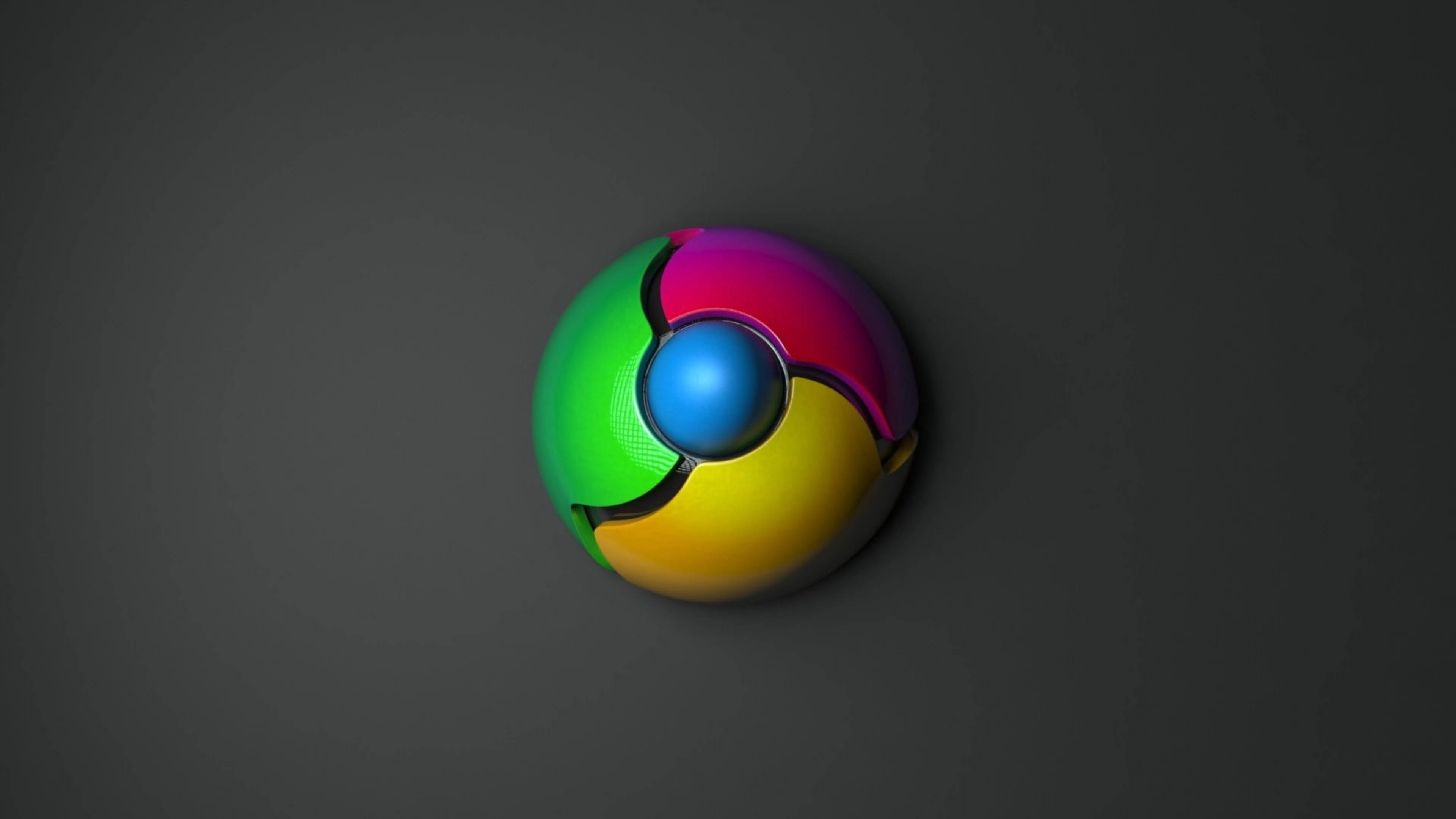 Google Chrome 桌布 壁紙 — 一個帶有鮮豔綠色、粉紅色、黃色和藍色部分的光澤鉻合金標誌，居中放置在深灰色漸變背景上。