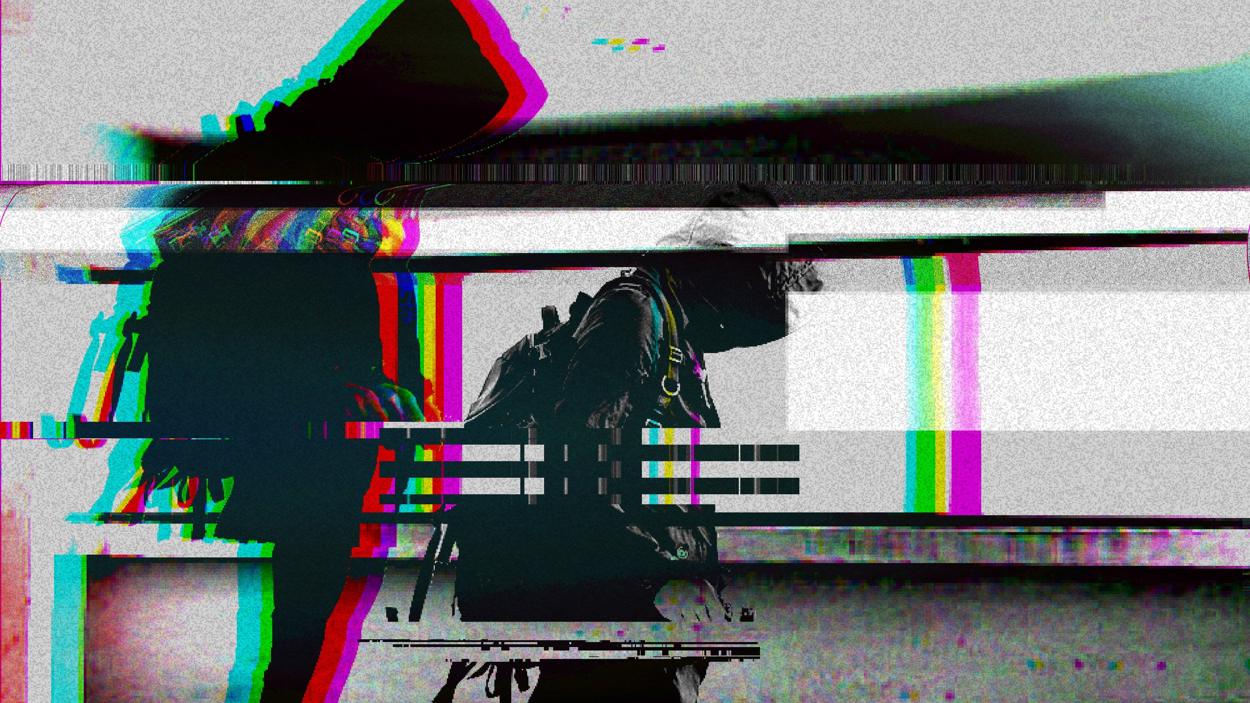 美學藝術 桌布 壁紙 — 一個帶有鮮豔色差和像素化扭曲的故障數位人物剪影。