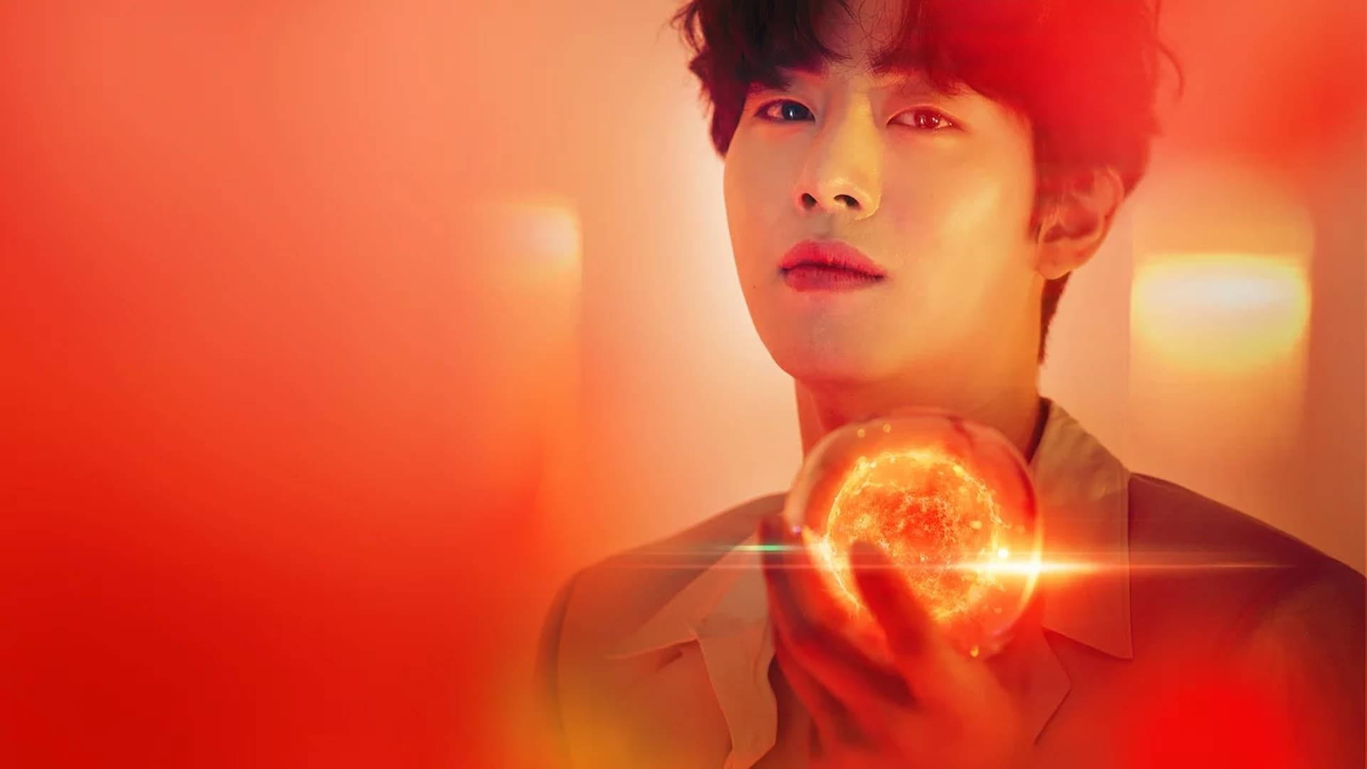 Ahn Hyo Seop 桌布 壁紙 — 一個年輕男子凝視前方，手持一個散發火焰光芒的發光球體，背景是溫暖的紅色。